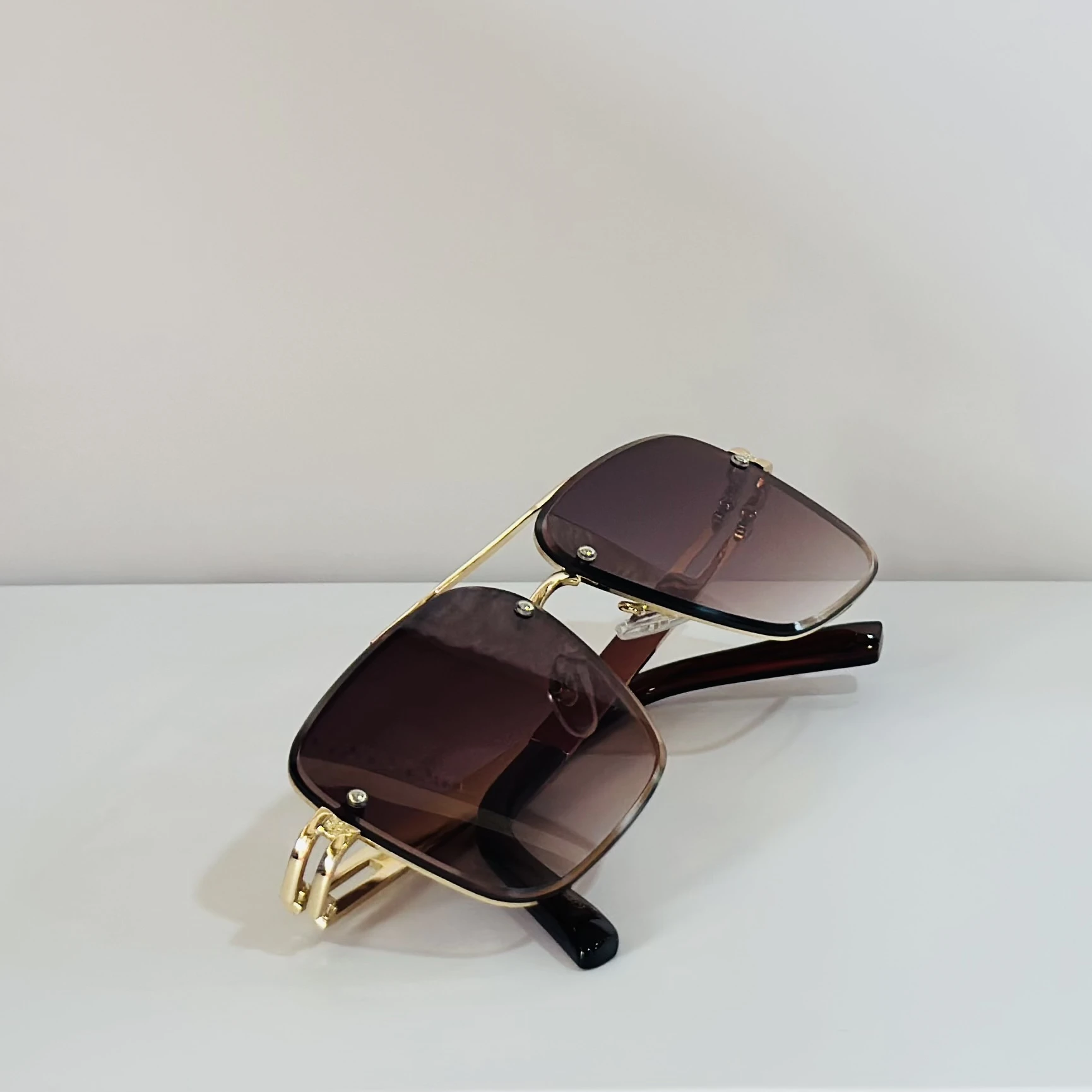 pair of Maybach aviator sunglasses with a gold-tone frame and brown gradient lenses
