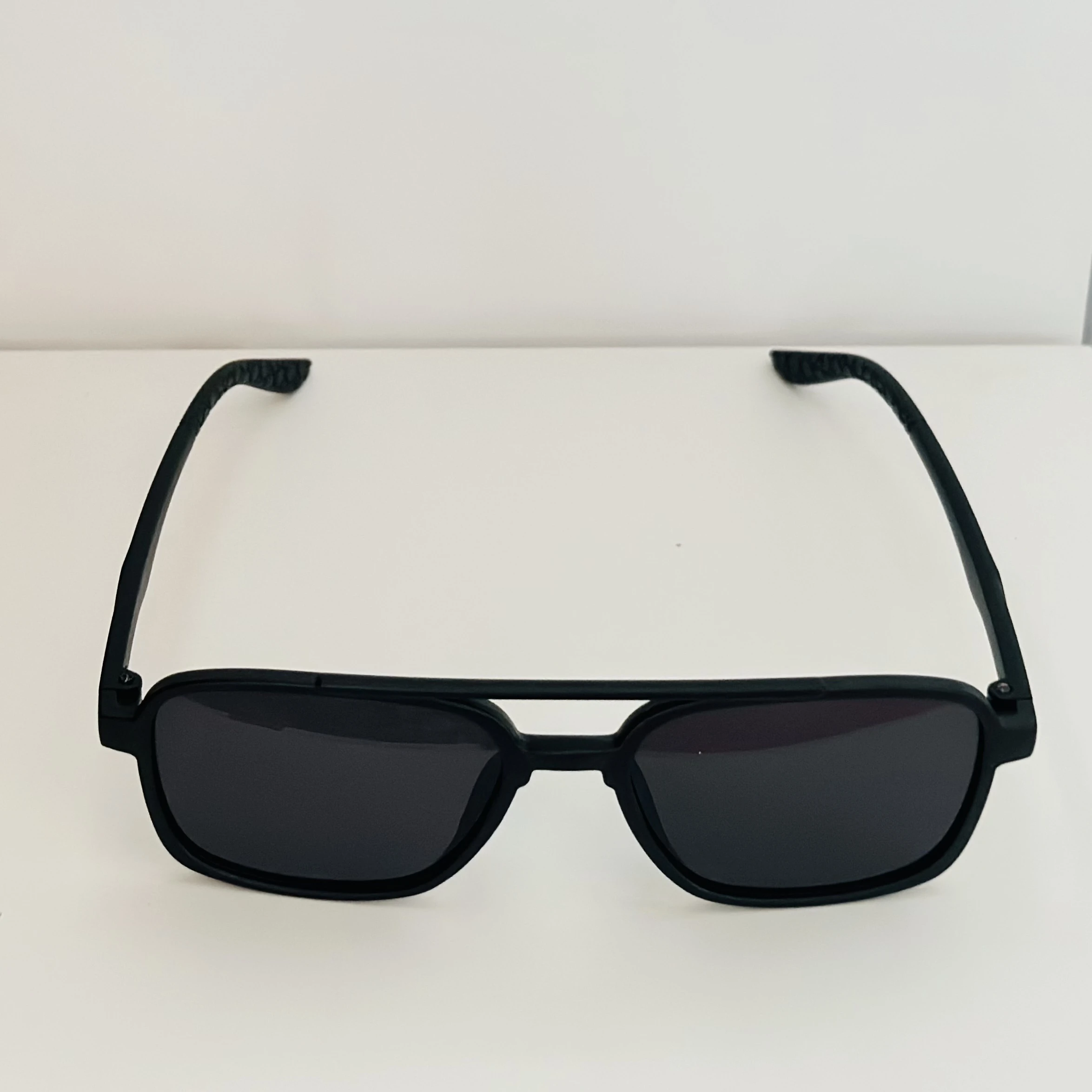 Vincent Chase black round sunglasses.