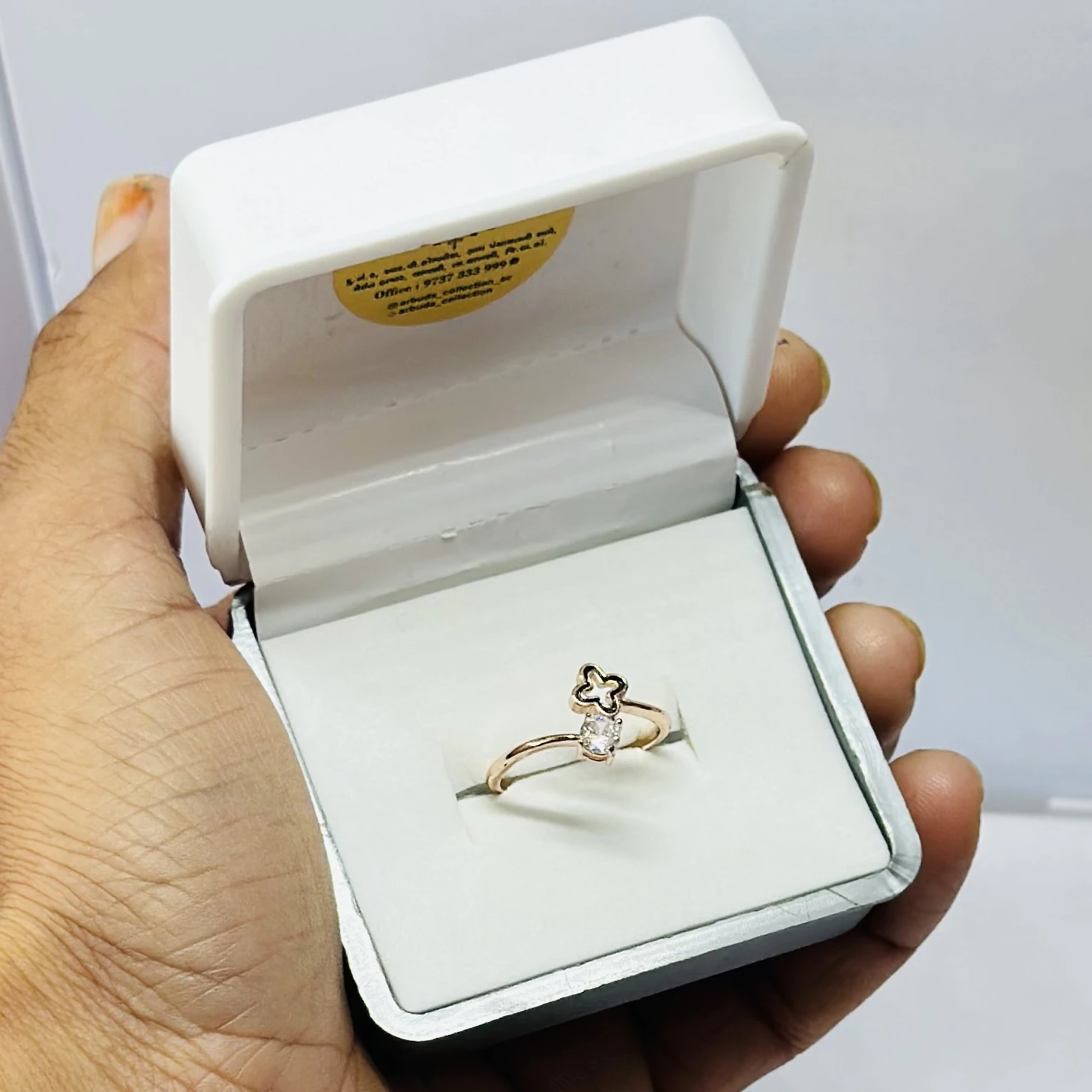 Rose gold-toned clover and diamond ring.