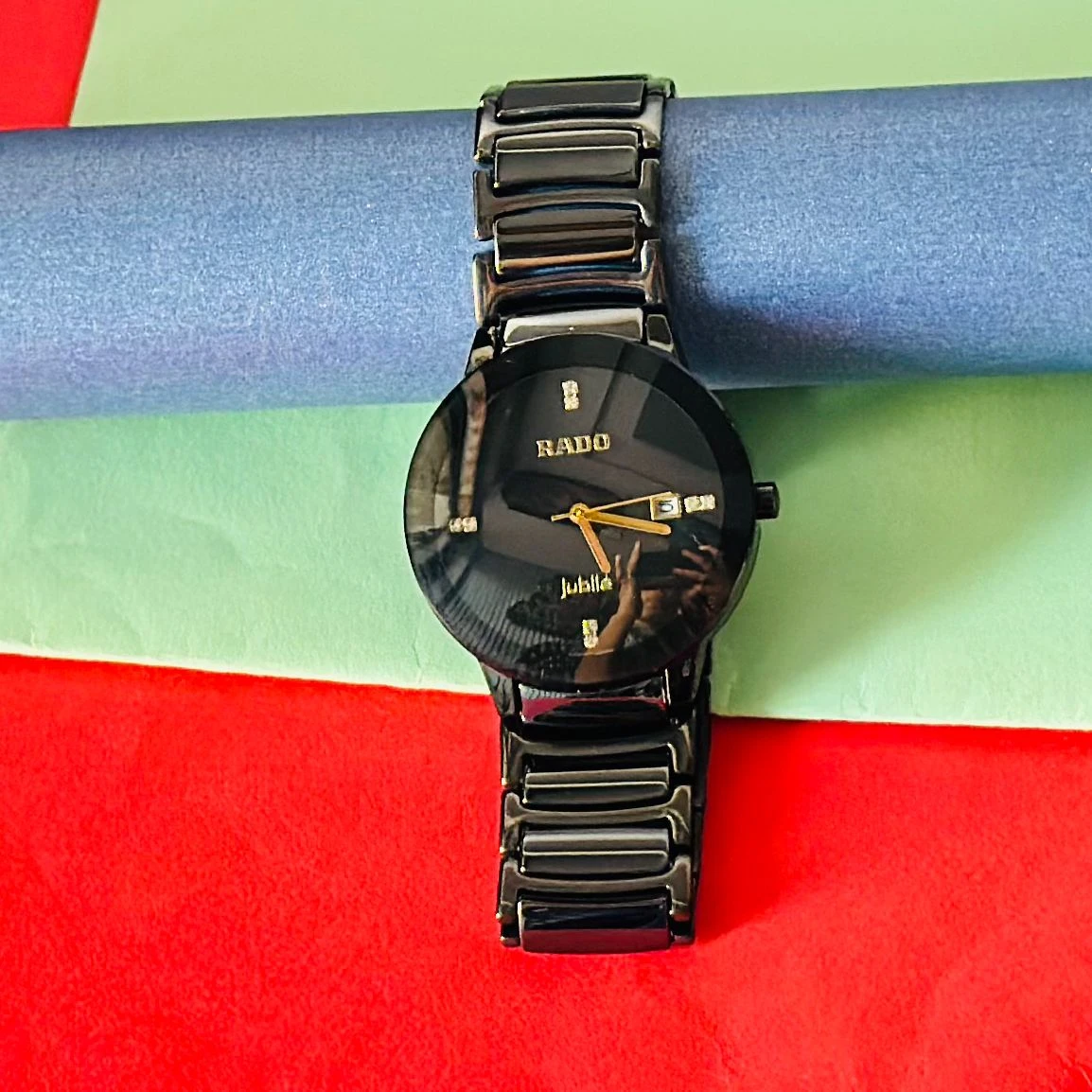 Rado Integral black ceramic and yellow gold-tone watch.