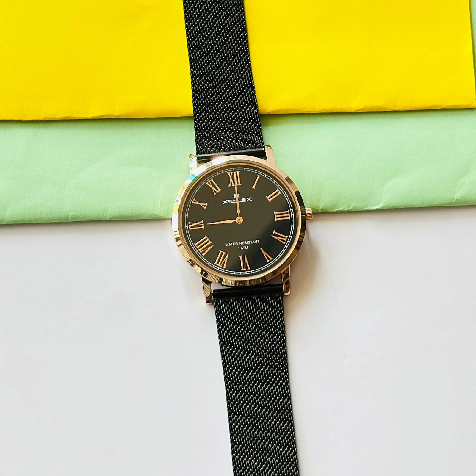 Black Snille Date Series analog watch with a white dial and black leather strap.