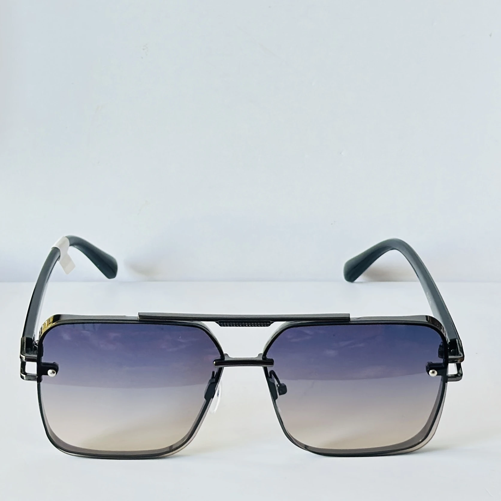 appear to be retro square or modern pilot-style sunglasses for men