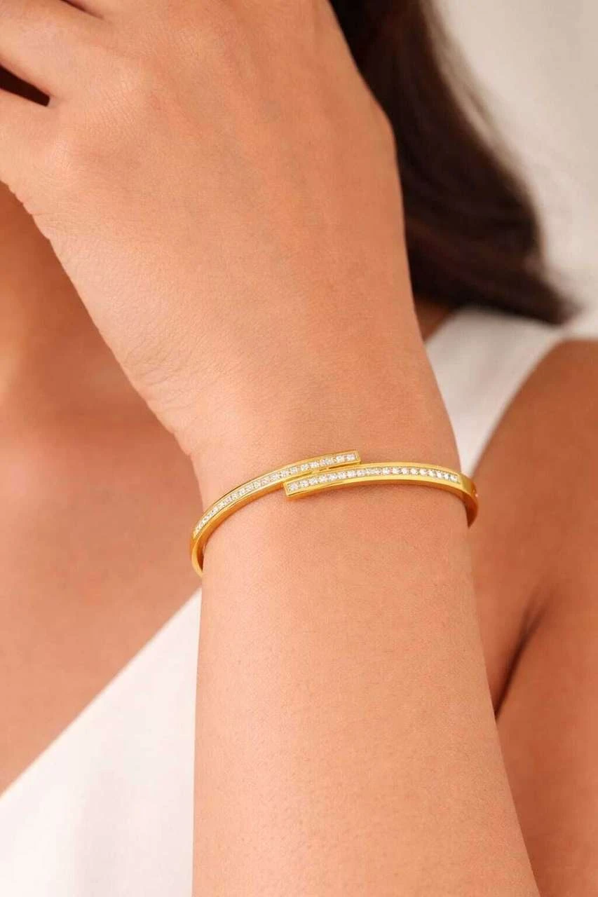 elegant gold-plated crystal-studded cuff bracelet