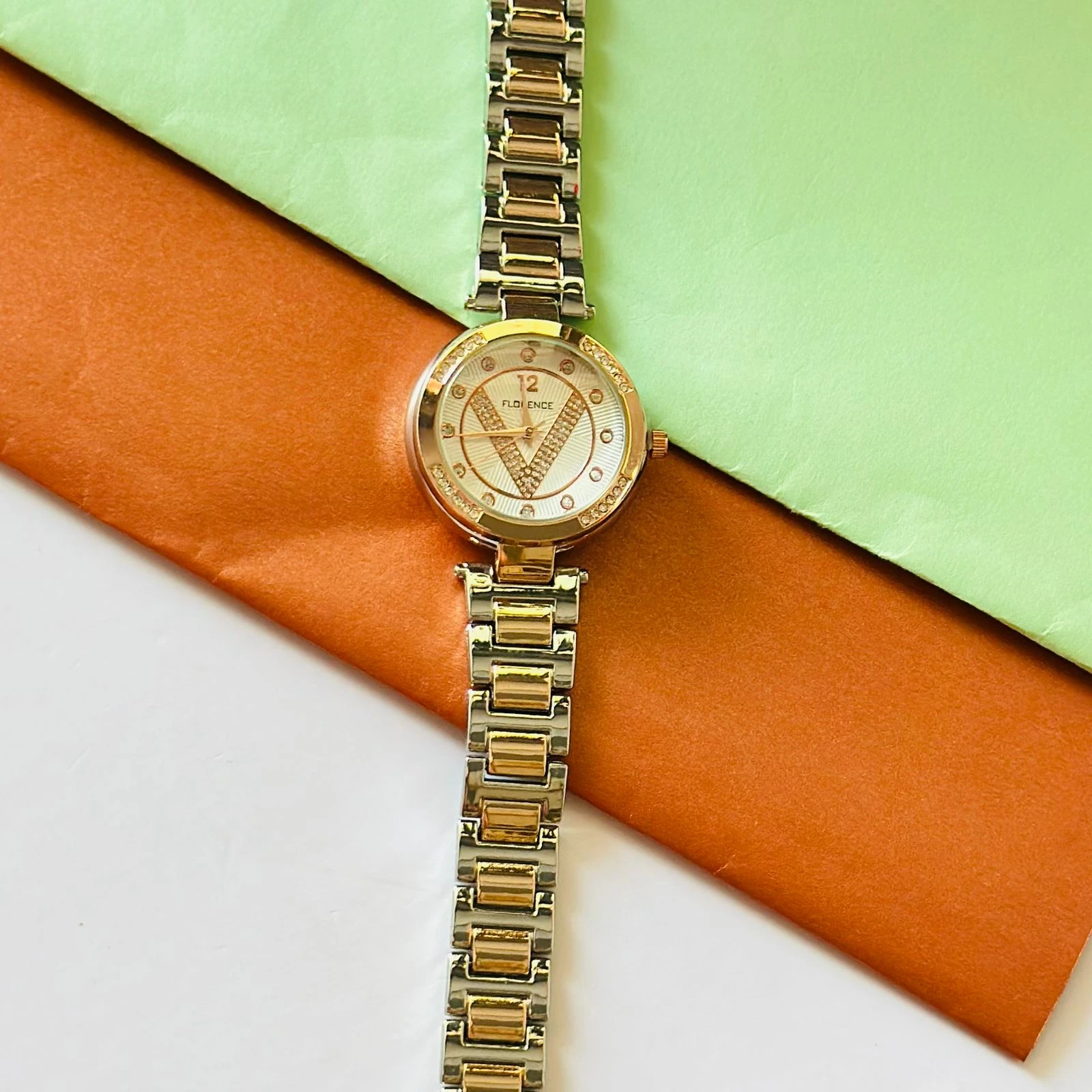 Florence brand two-tone metal analog watch for women.