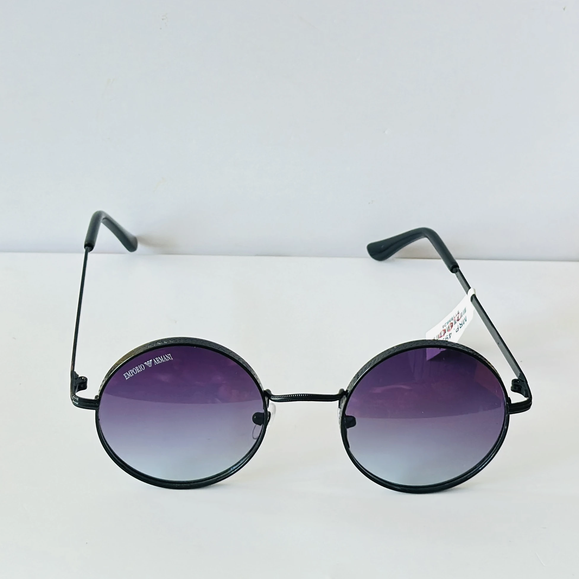 pair of round purple-tinted sunglasses