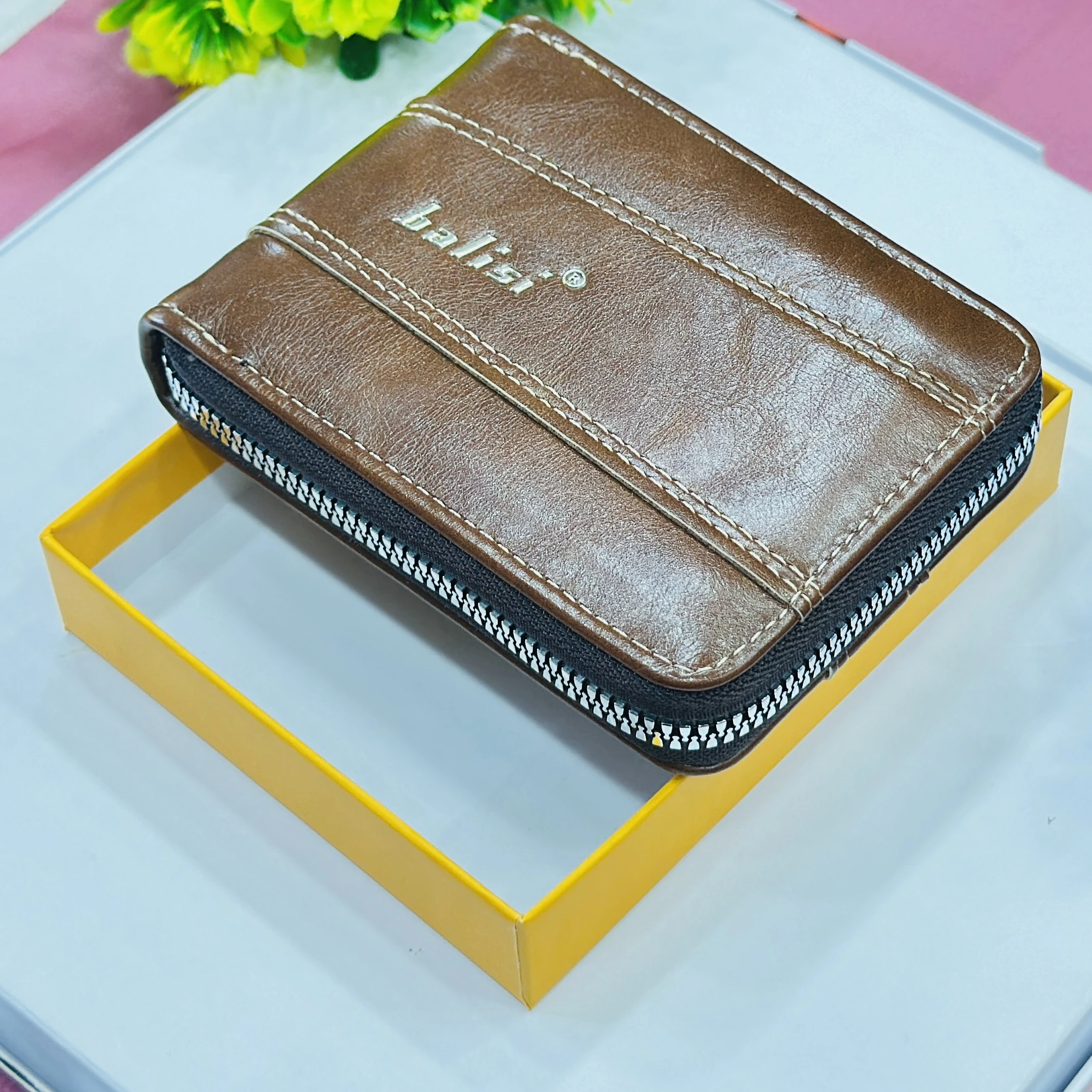 Balisi brand men's wallet is a brown zip-around PU leather wallet.