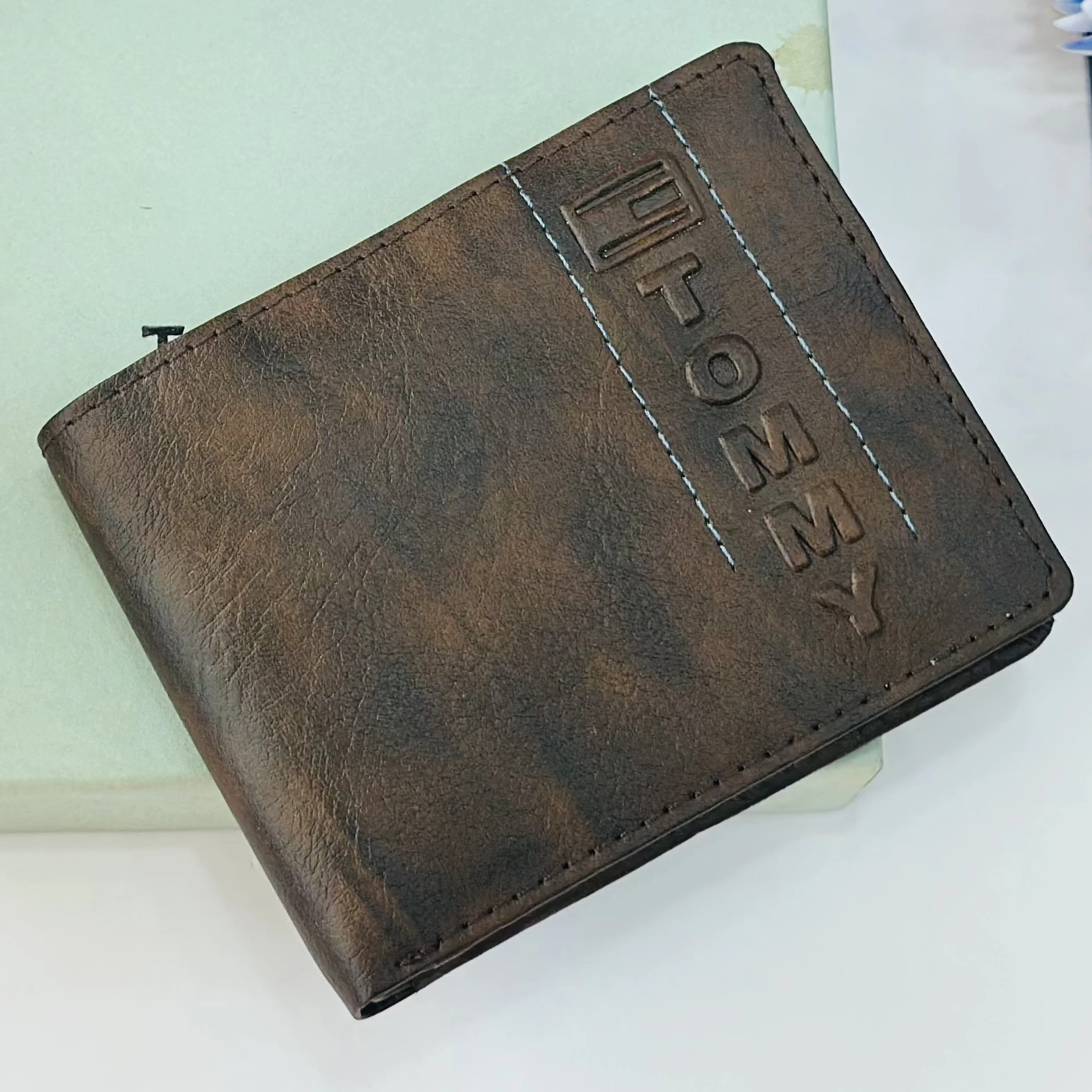 Brown bifold wallet from the brand Tommy.