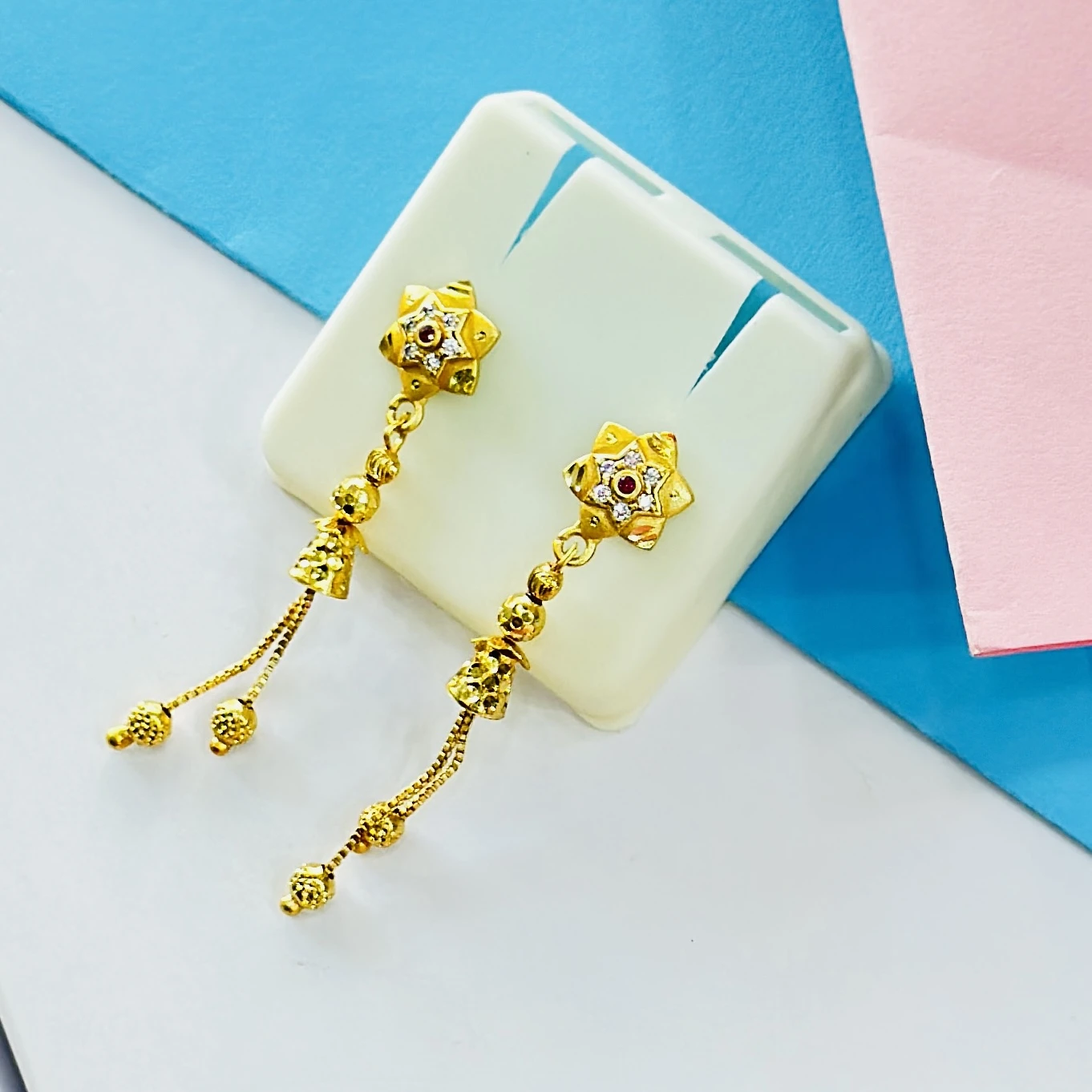 pair of intricate gold drop earrings