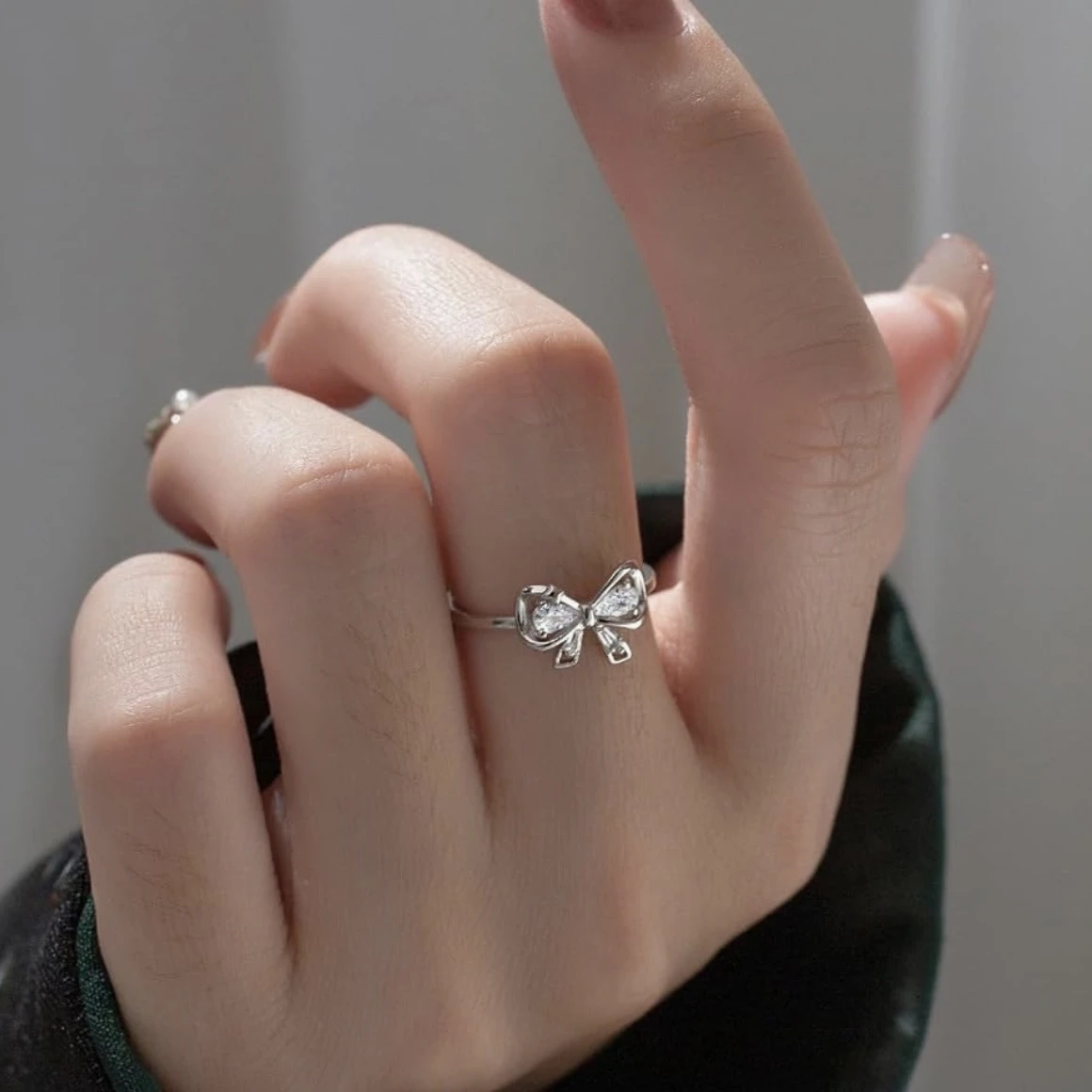 silver mini bow tie adjustable ring for women.