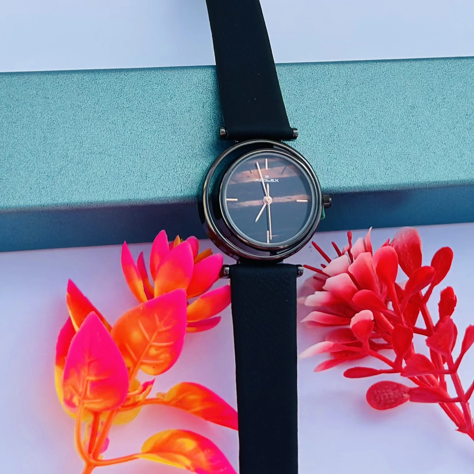 Analog Wrist Watch for Women, in the black variant with a brown/black dial.