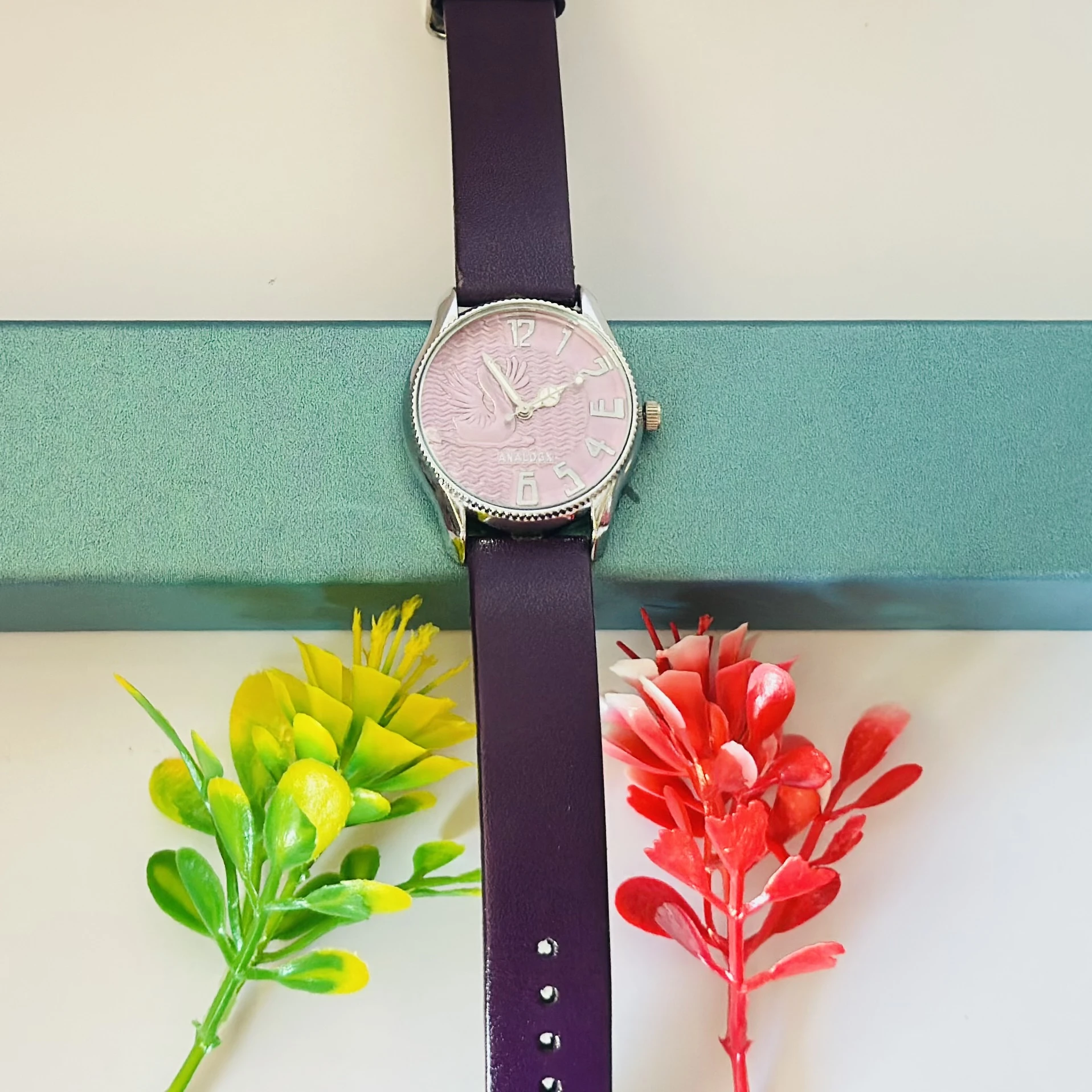 Sure Shot analog watch with a black leather band and silver-tone case.