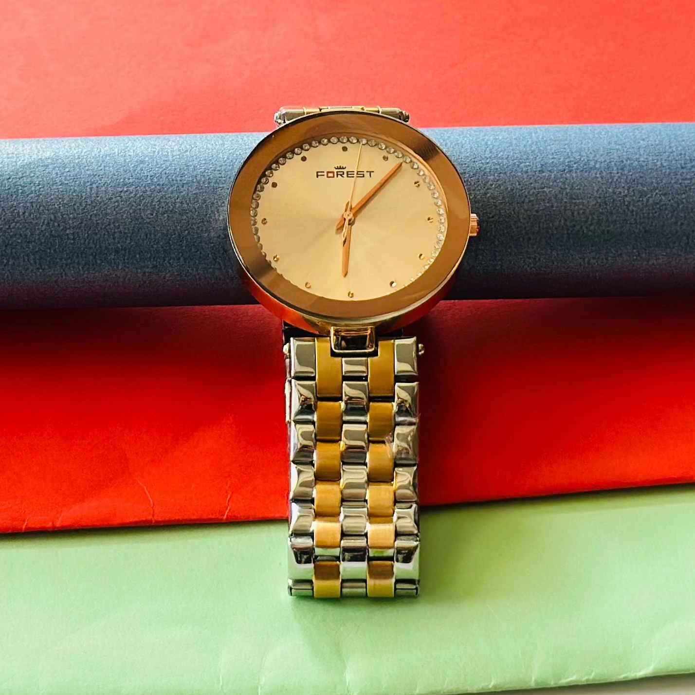 Forest women's watch with a round, gold-tone case