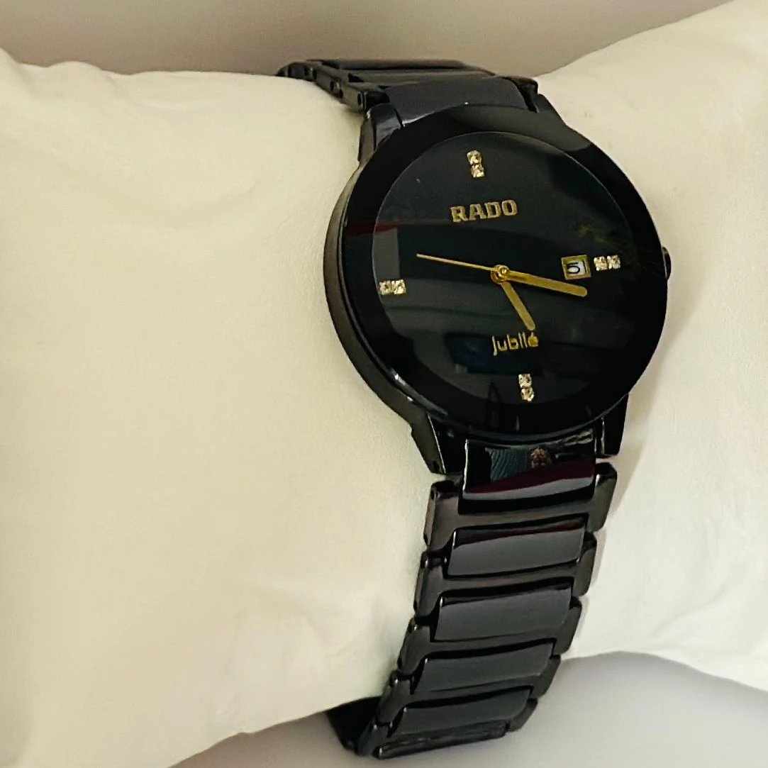 Rado Integral black ceramic and yellow gold-tone watch.