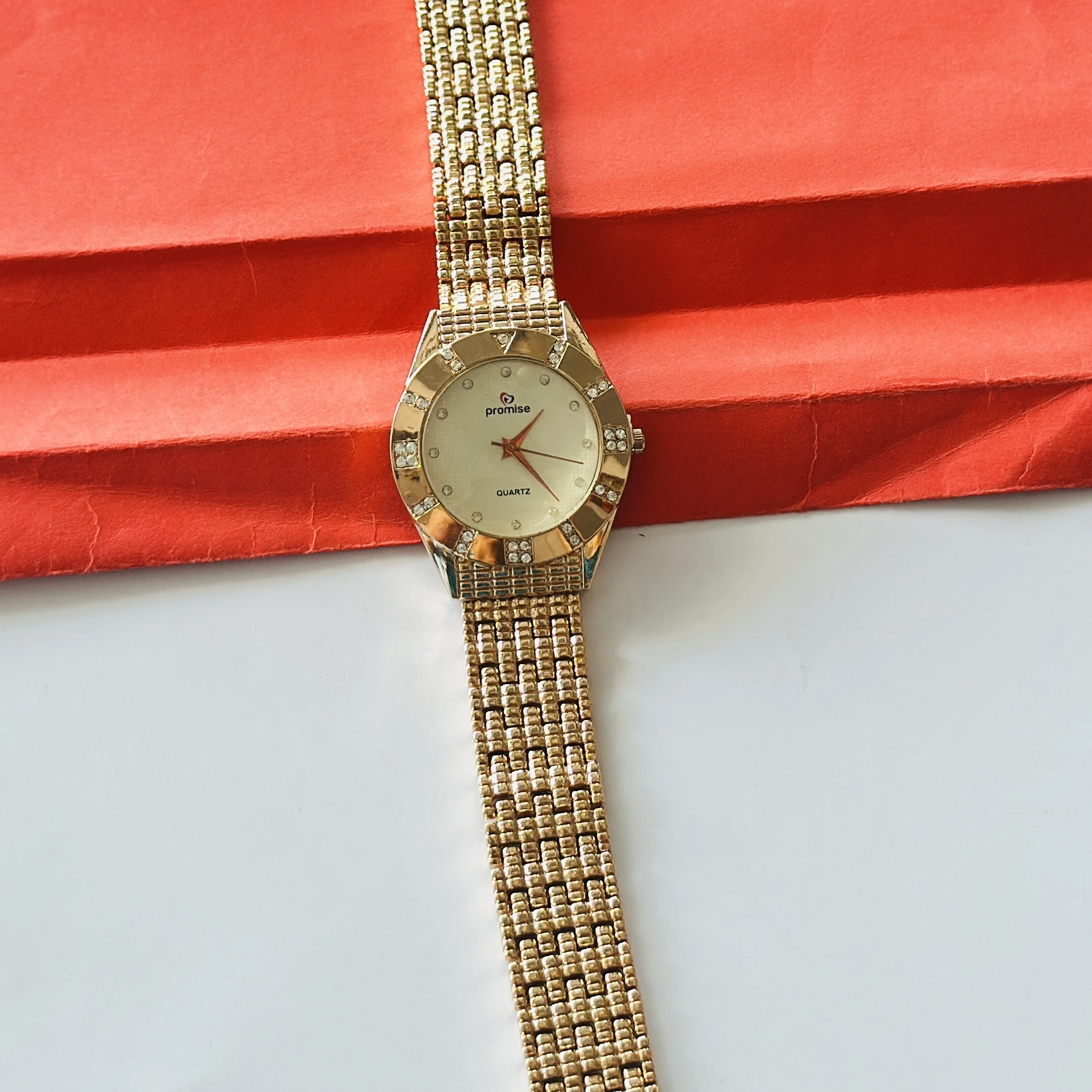 gold-toned Promise brand quartz women's watch