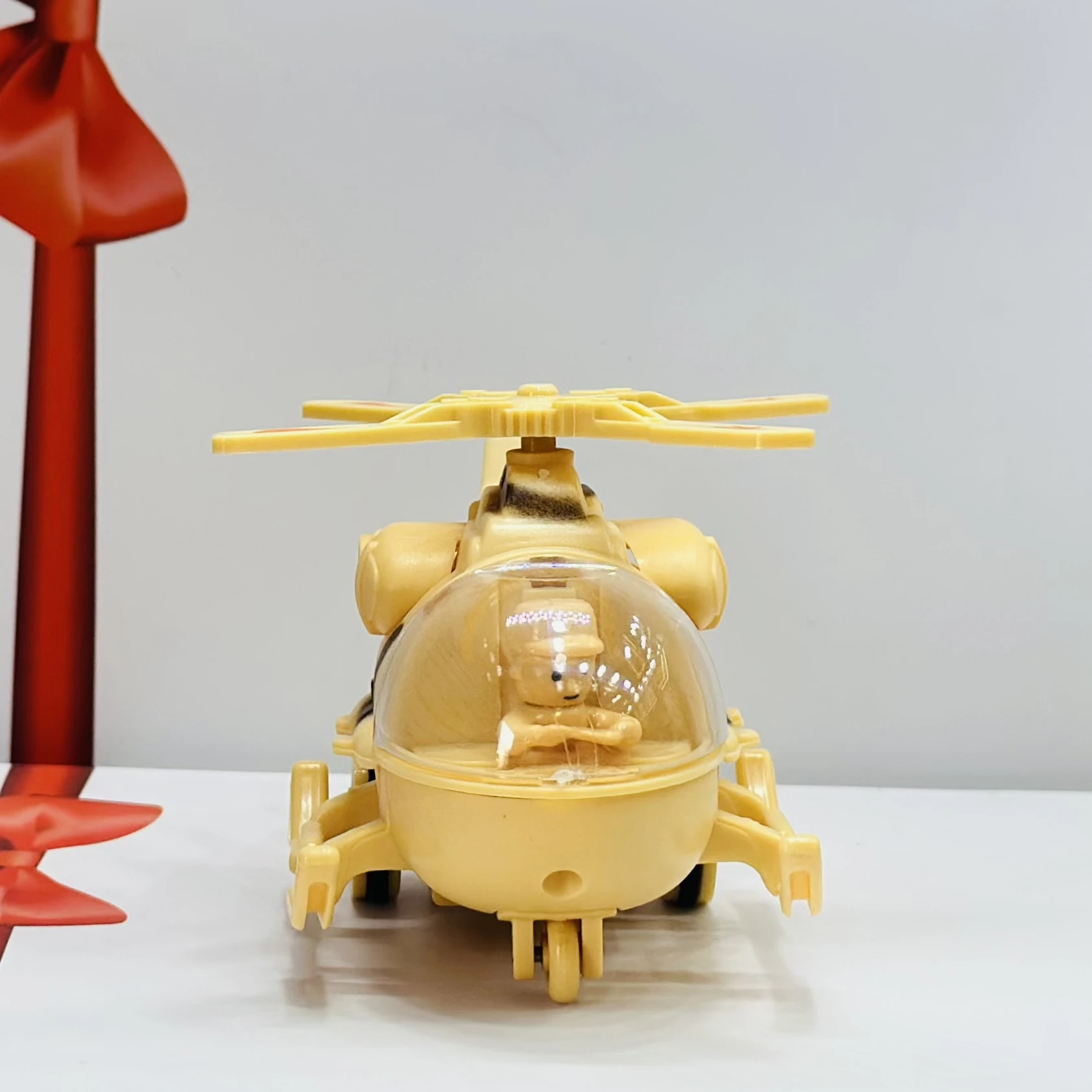 friction-powered toy helicopter