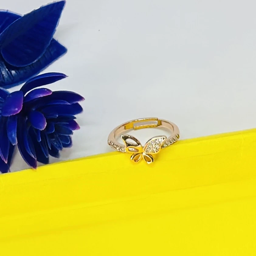 Gold plated alloy butterfly ring with a vintage style and clear stones.