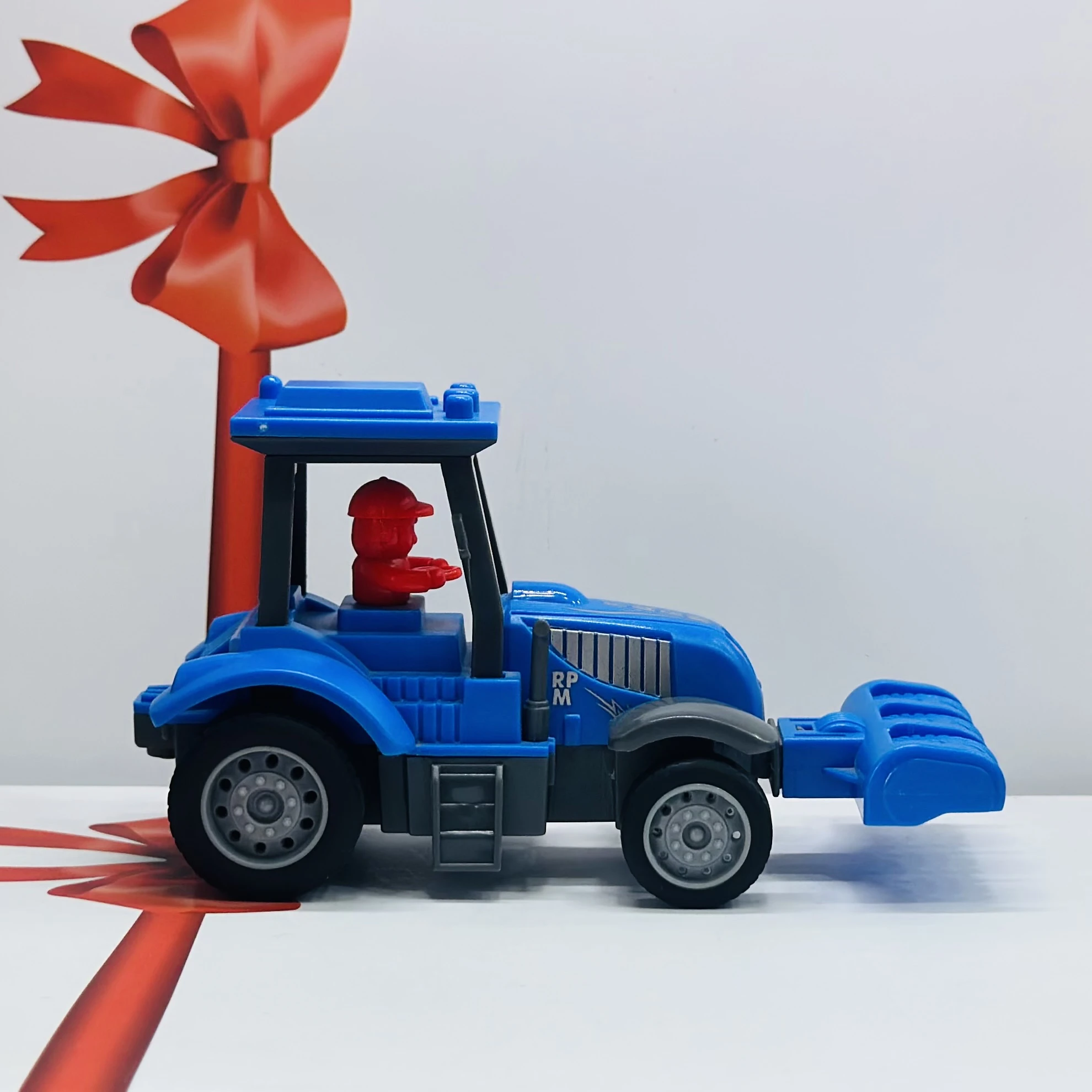 Blue plastic toy tractor
