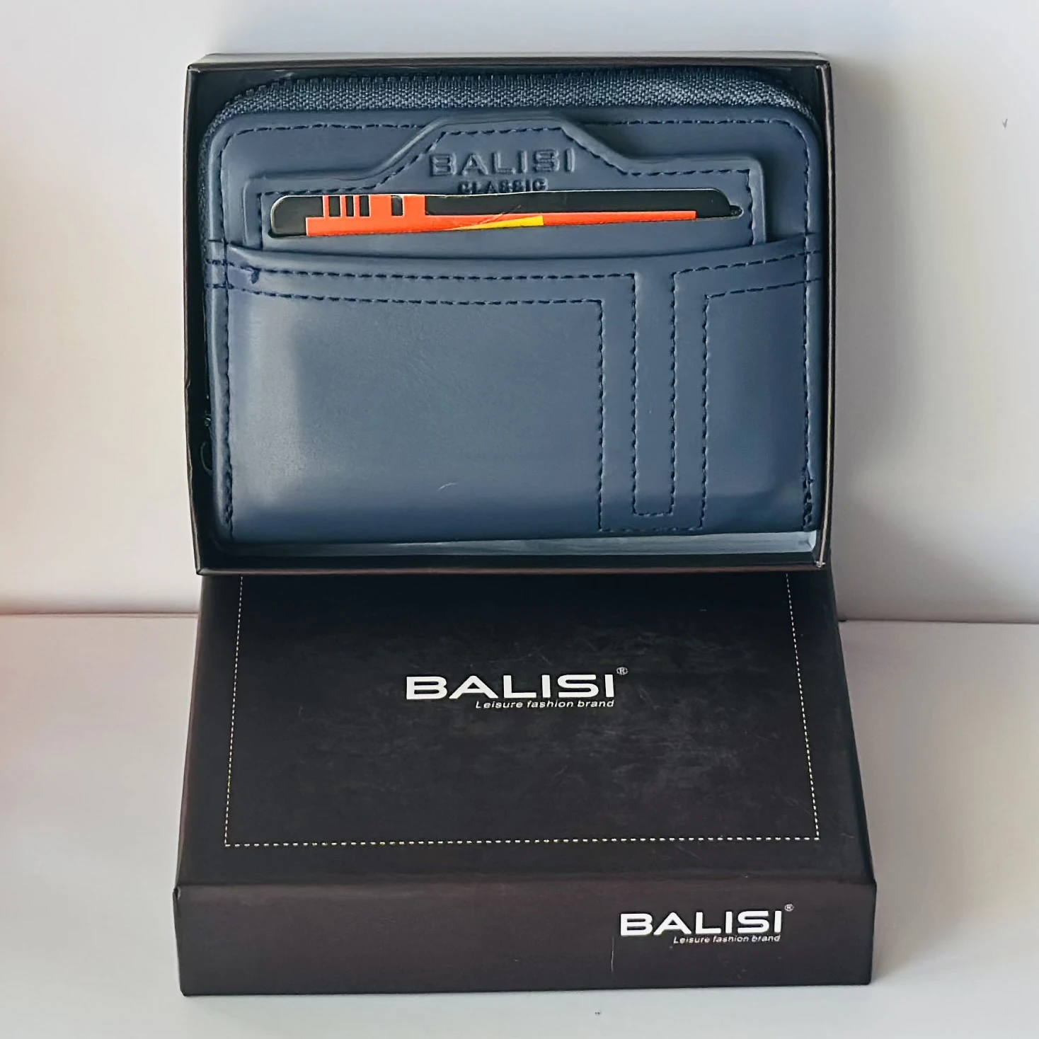 Balisi plain zip button men's wallet in a blue color, likely made of PU leather.