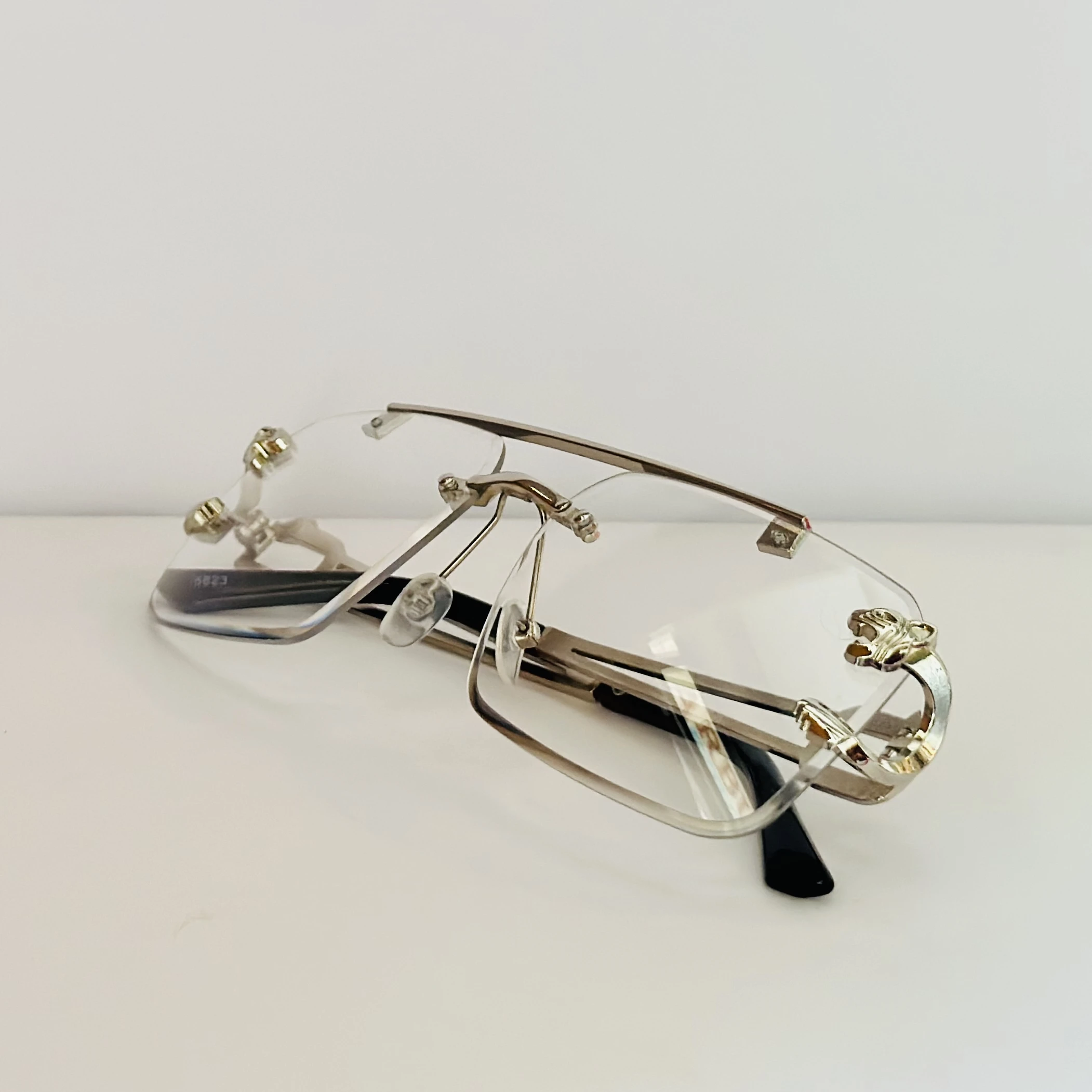 RioRabbit Mobster silver-frame rimless square eyeglasses with blue light blocking technology.