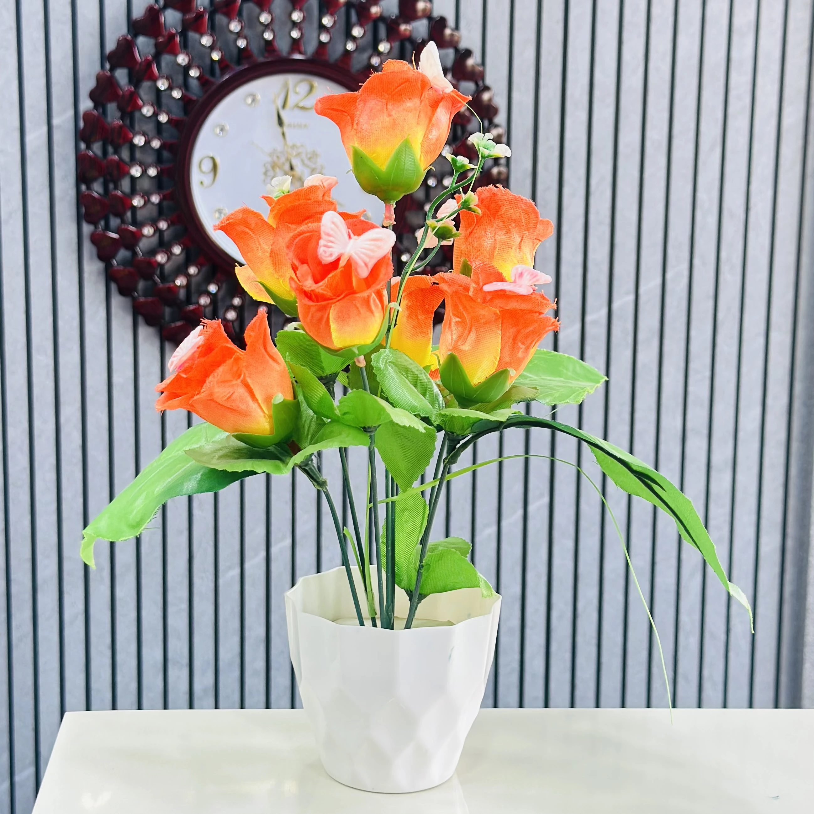 Apple Rose artificial flower bunch with a white pot.