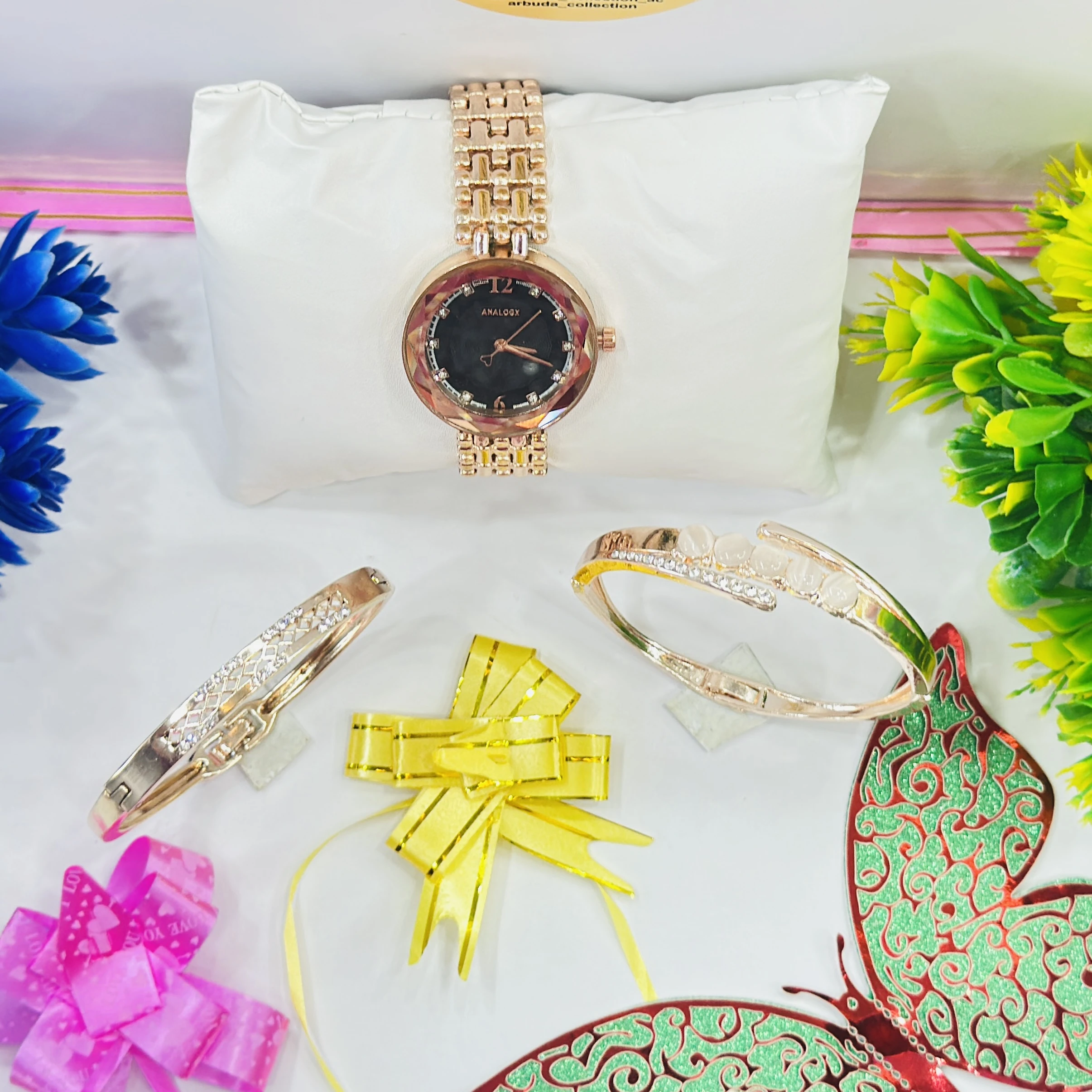 ladies' rose gold-tone Analogx brand watch set that includes matching bracelets.