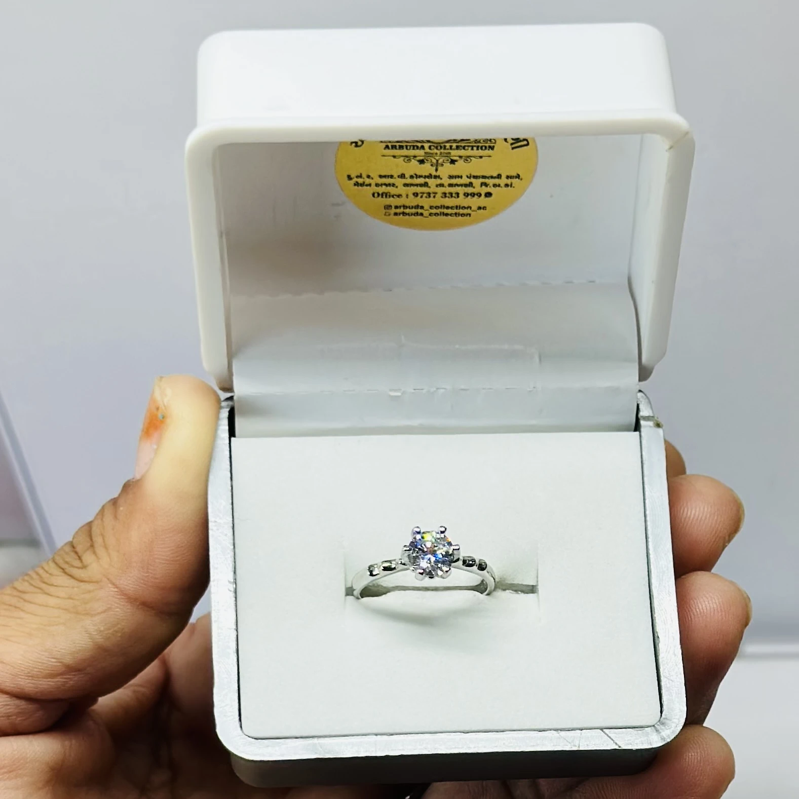 Silver solitaire engagement ring with American diamonds.