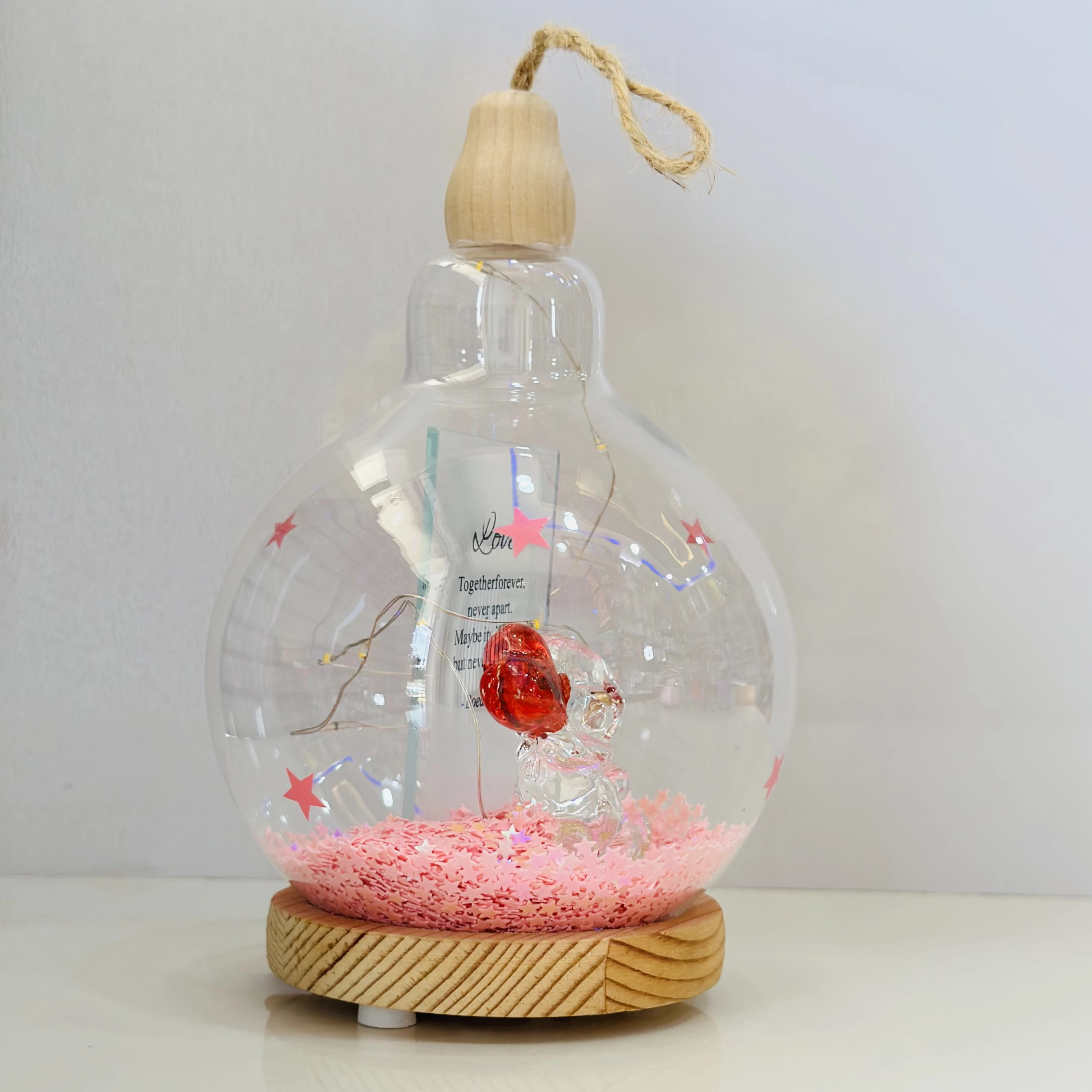 decorative glass dome with LED lights, featuring a couple figurine inside.(SKU-5NELVH)