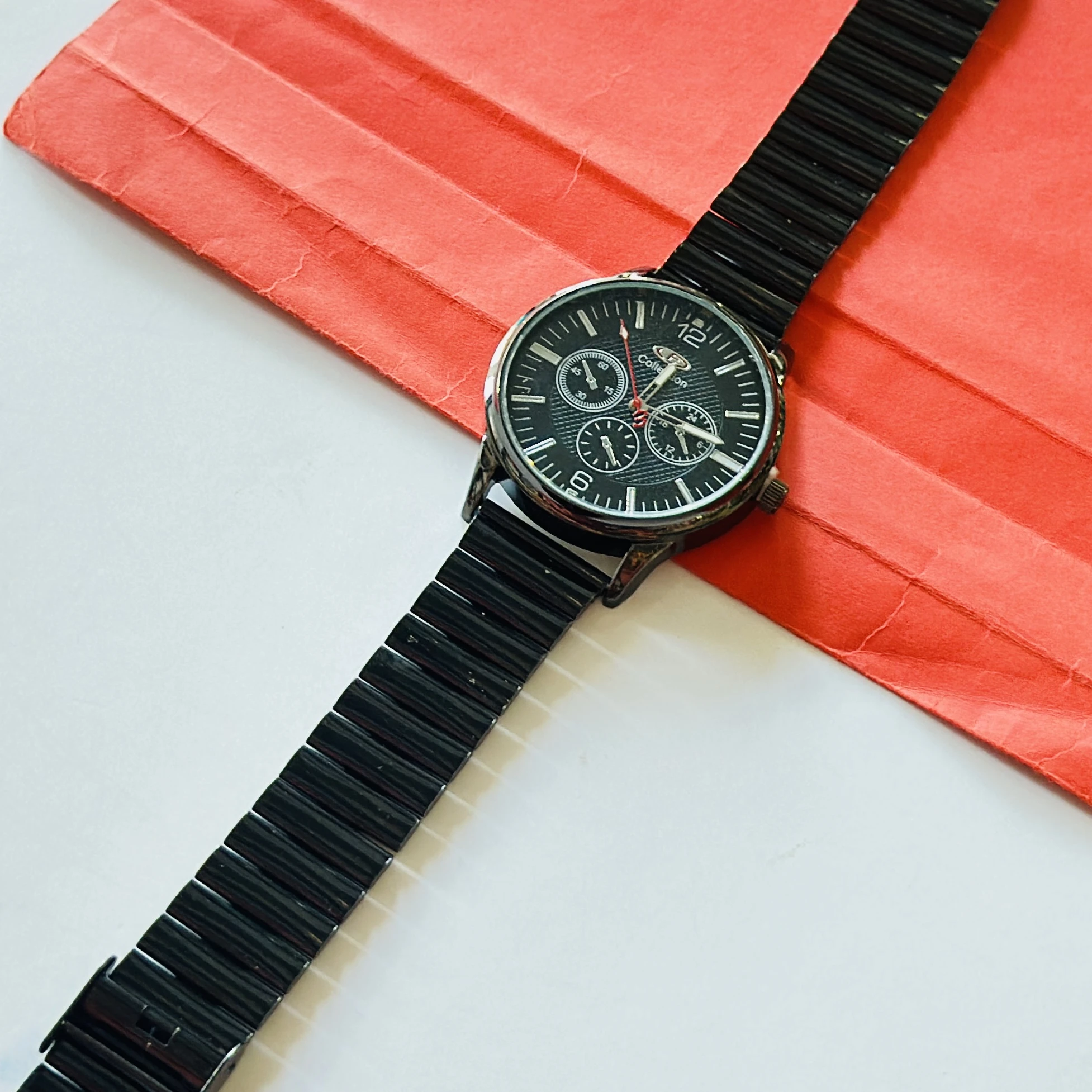 Foce men's chronograph watch with a black dial and a metal strap.