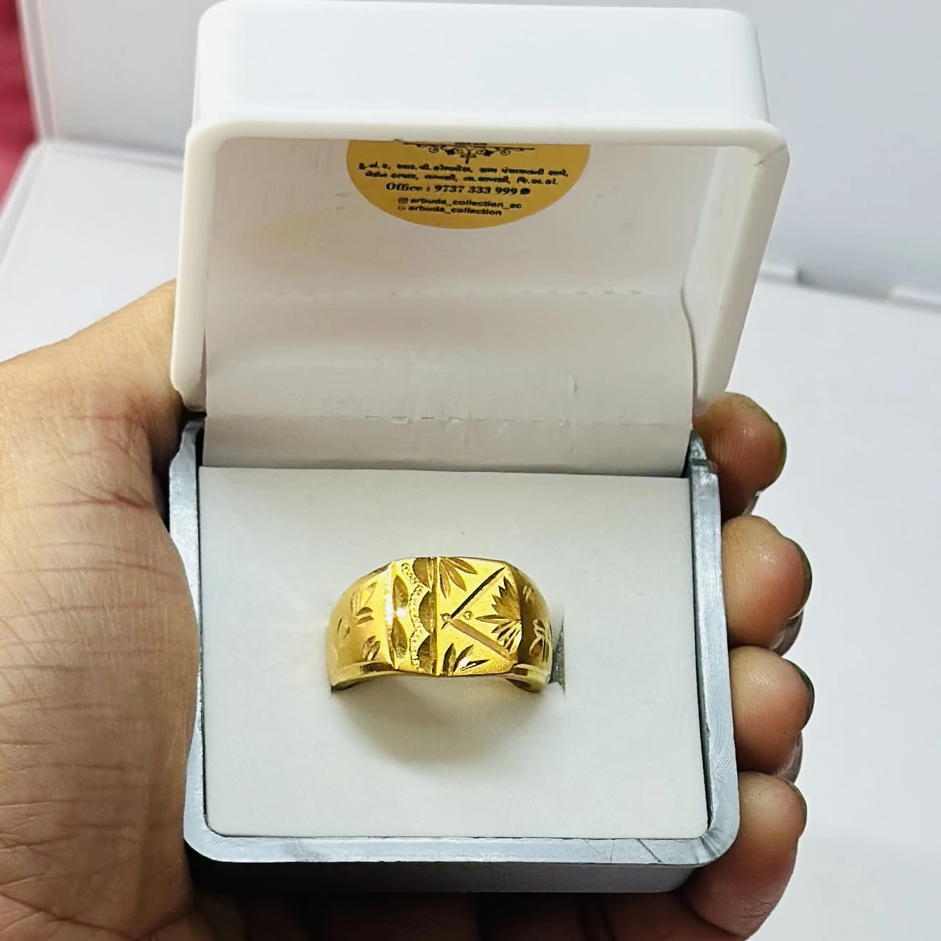 22kt gold men's ring with a geometric pattern.