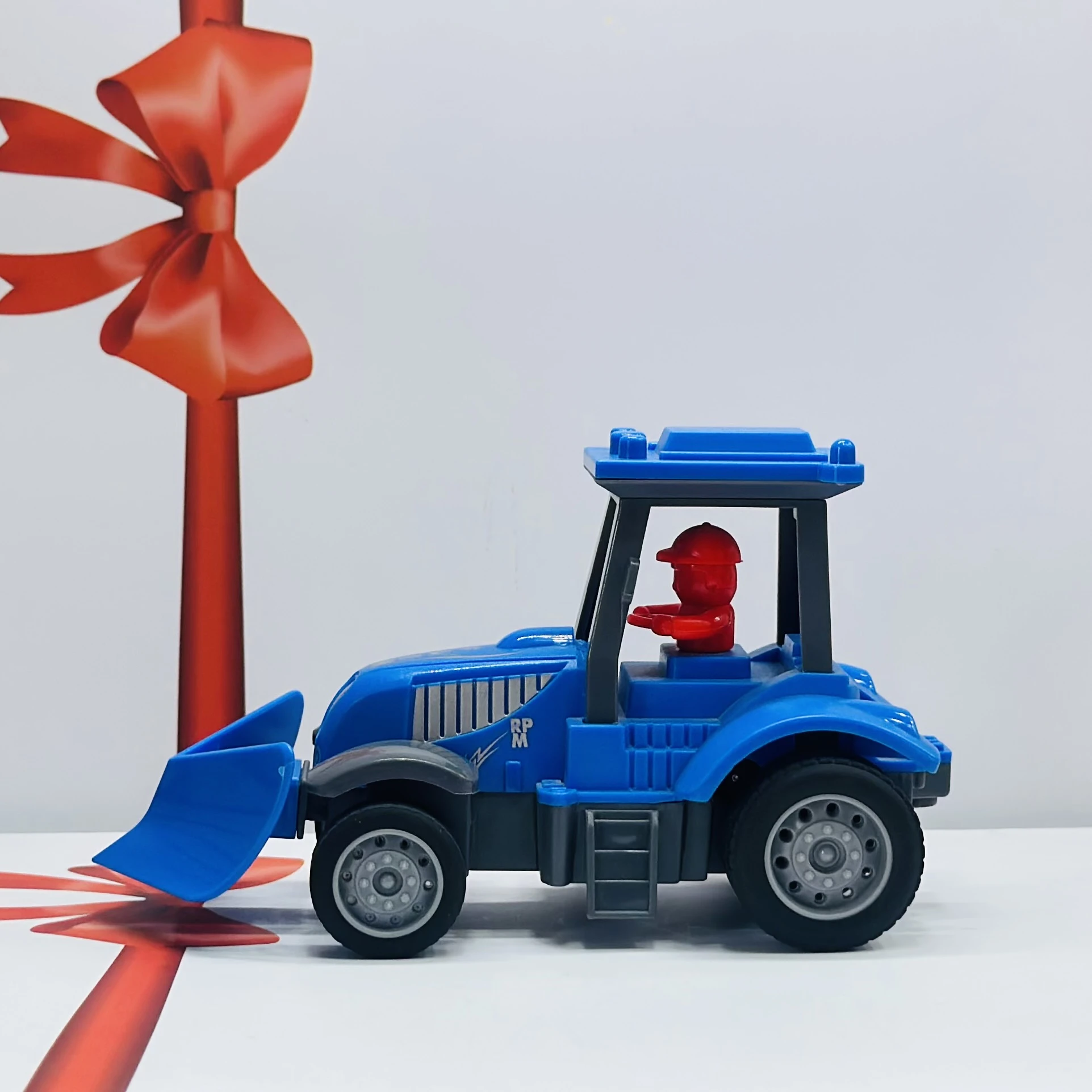Blue plastic toy tractor