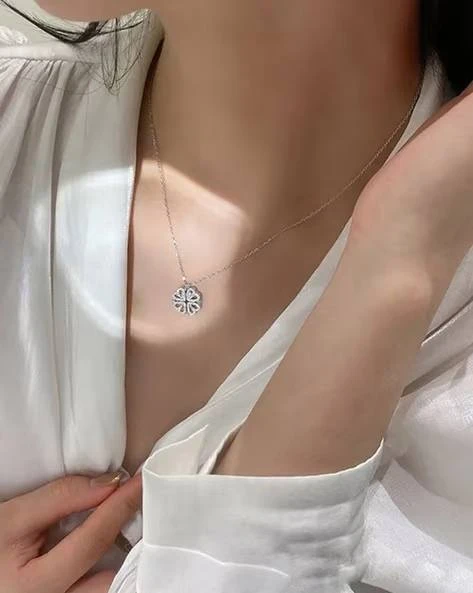 silver-toned, magnetic four-heart clover pendant necklace made of stainless steel