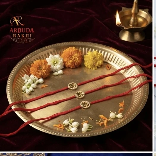 Silver Om-themed rakhis, featuring gold plating and stone studding.