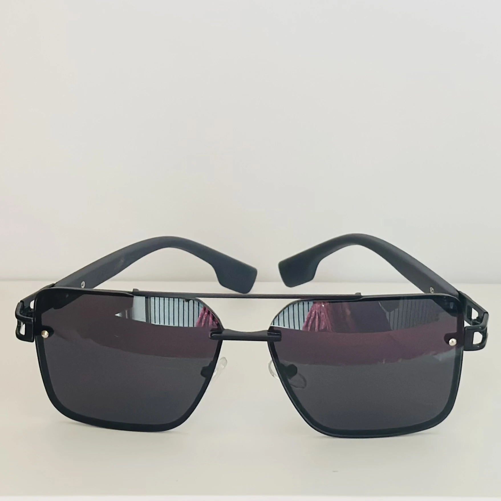 pair of black metal rectangular sunglasses.