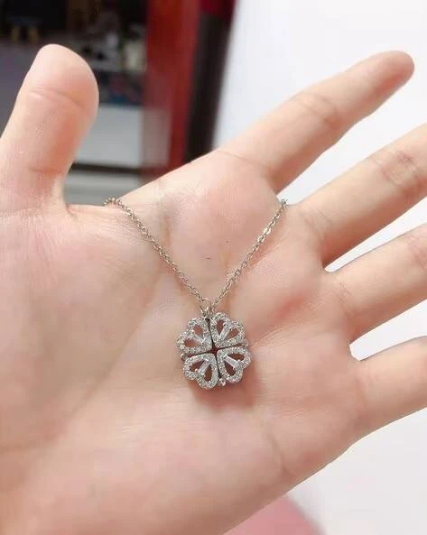 silver-toned, magnetic four-heart clover pendant necklace made of stainless steel