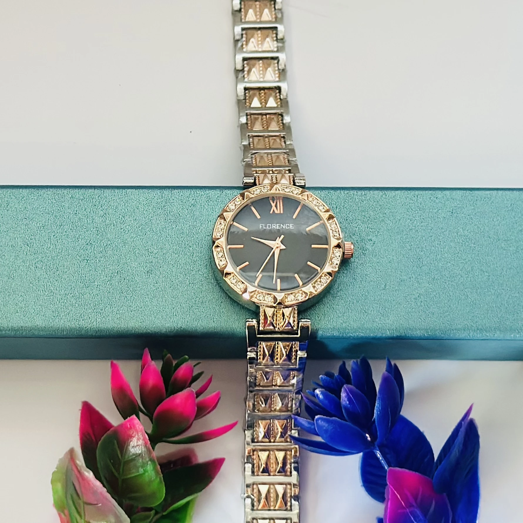 women's analog watch with a two-tone (silver and rose gold) metal strap