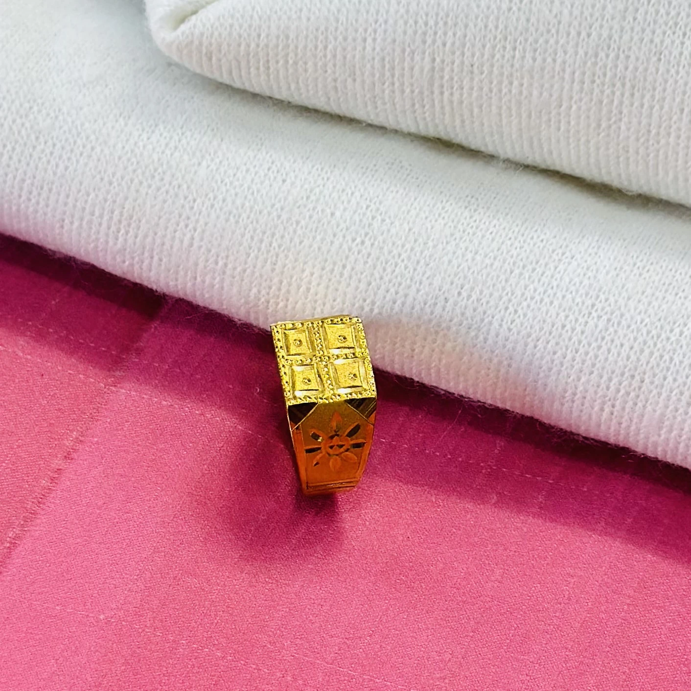 Gold ring for men with a matte finish and detailed square design.