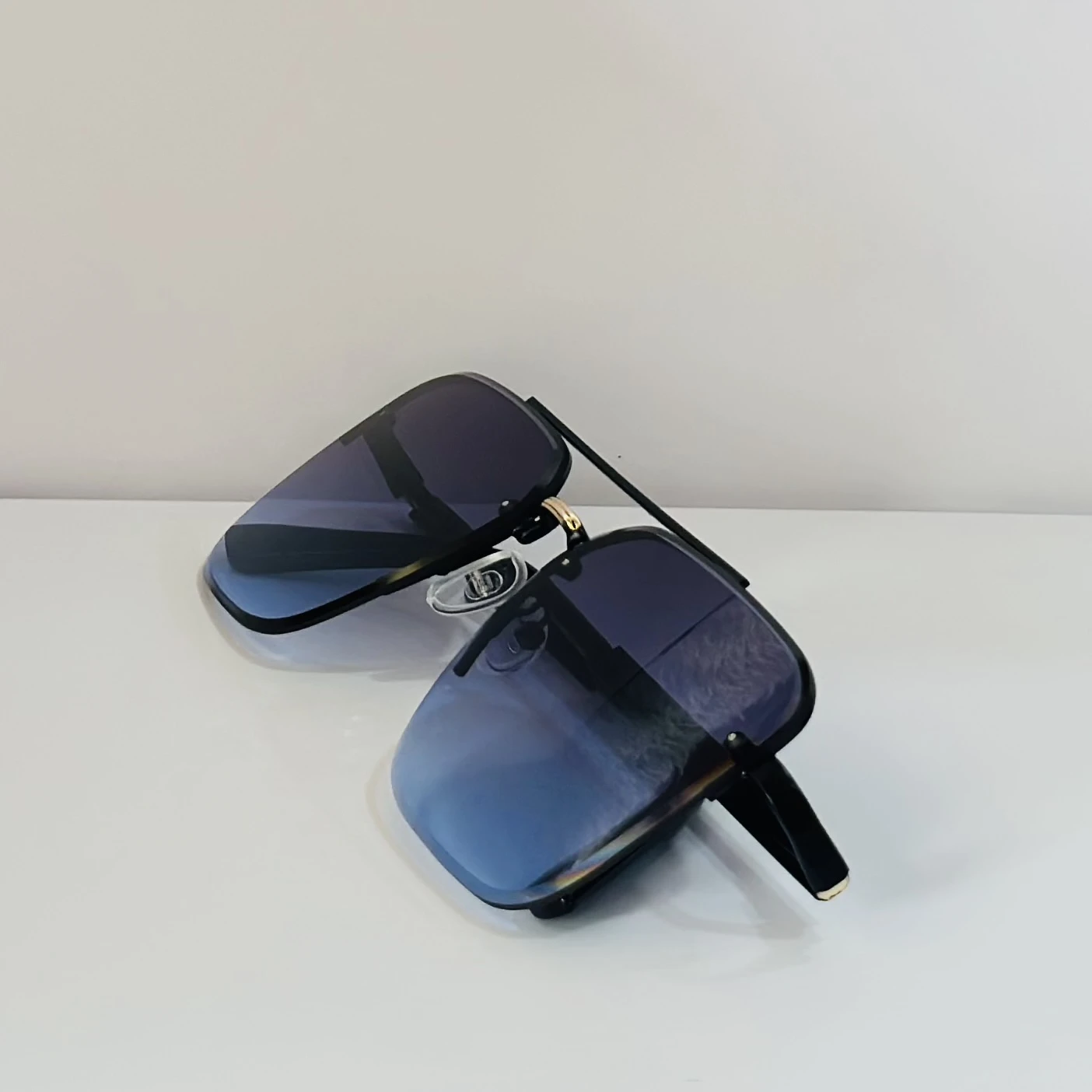 pair of Grey Jack Retro Square or Iron Man Square sunglasses with blue and grey lenses and a black frame.