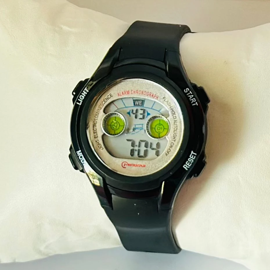 black Mingrui digital sports watch with a plastic or rubber strap.