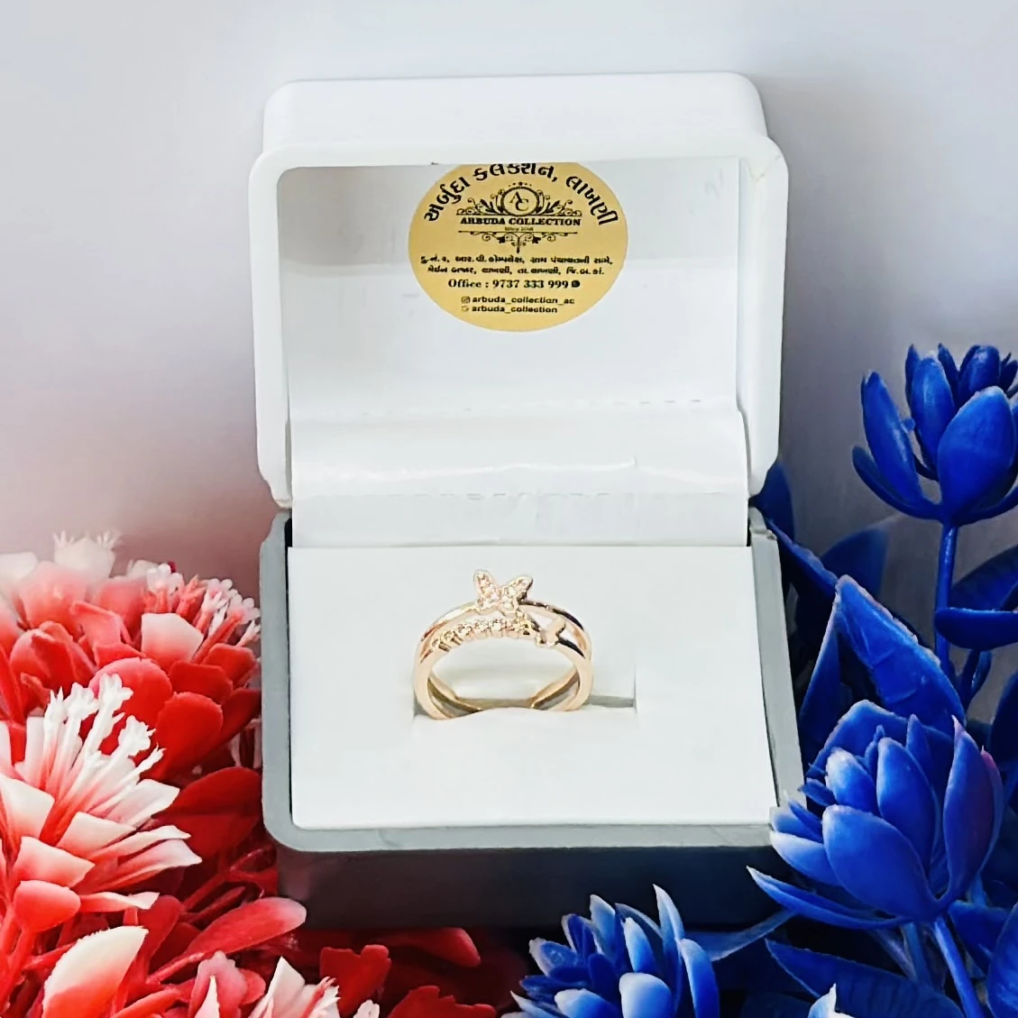 Rose gold plated cubic zirconia butterfly double band ring.