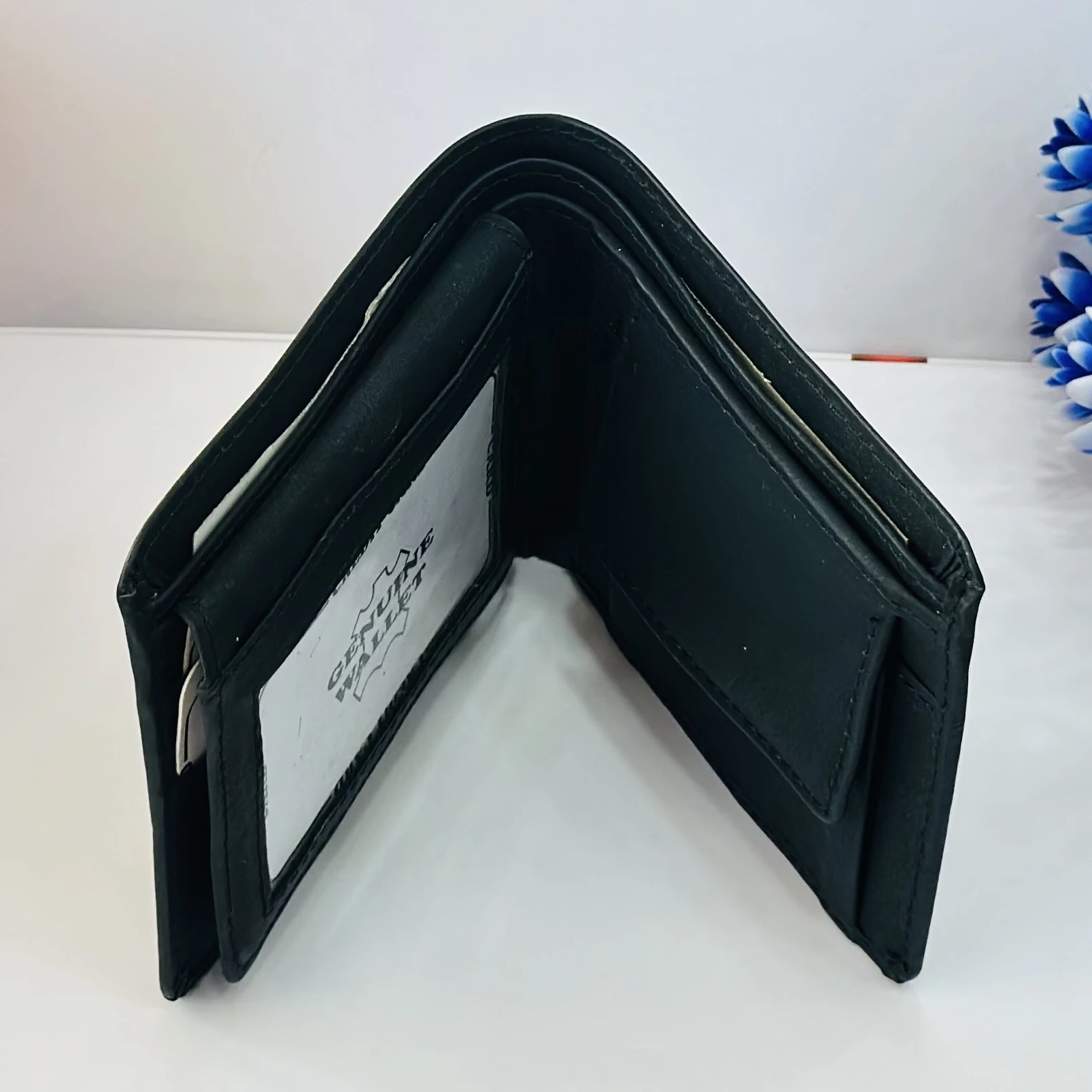 Black genuine leather bi-fold wallet