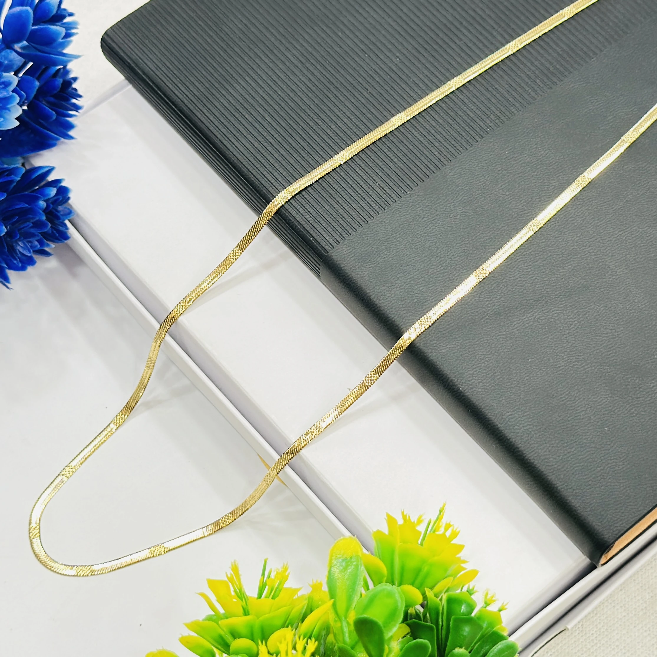 premium gold-plated herringbone snake chain.