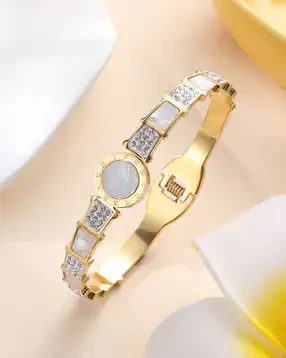 stainless steel gold-plated mother of pearl Roman numerals AD studded bracelet.