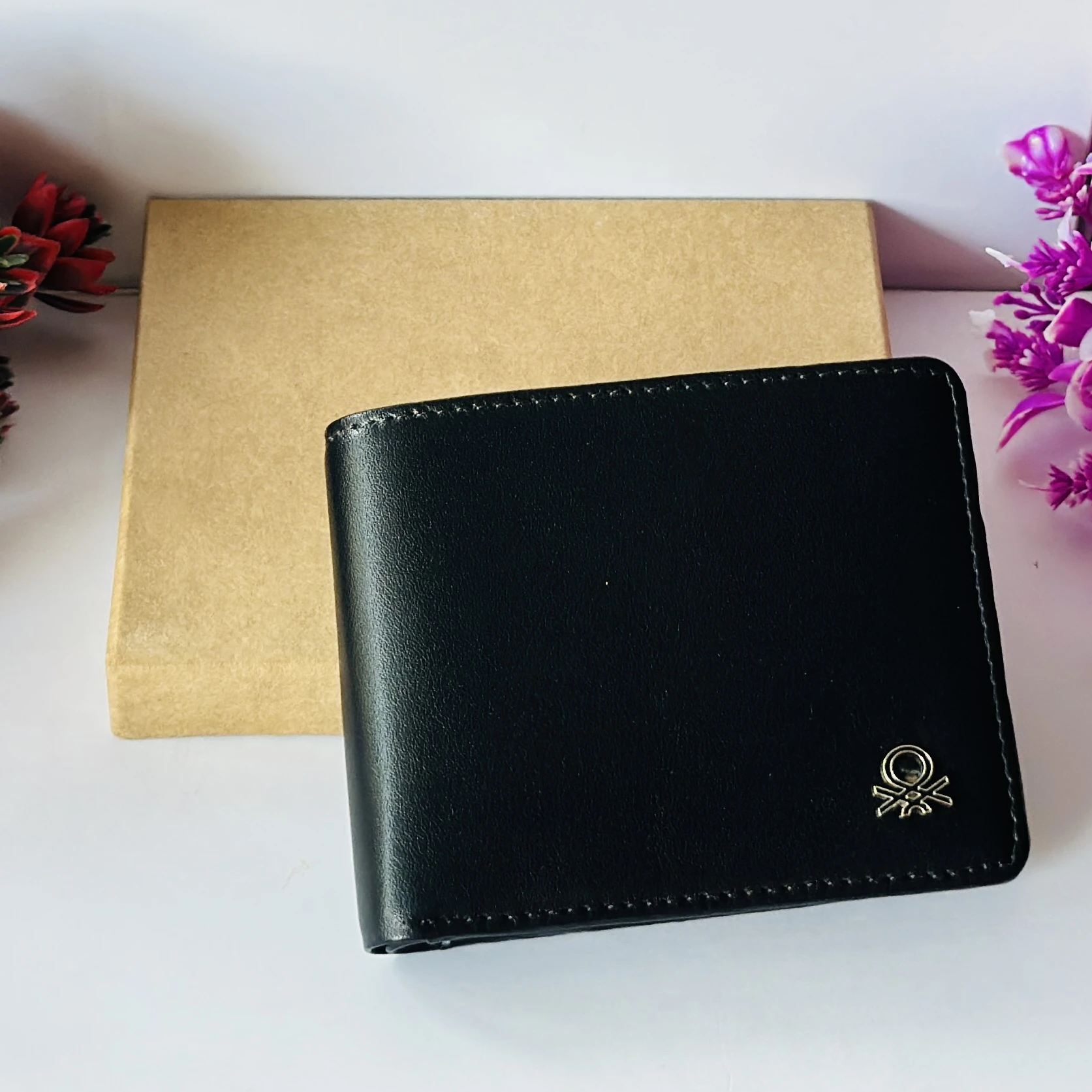 United Colors of Benetton black leather bi-fold wallet.