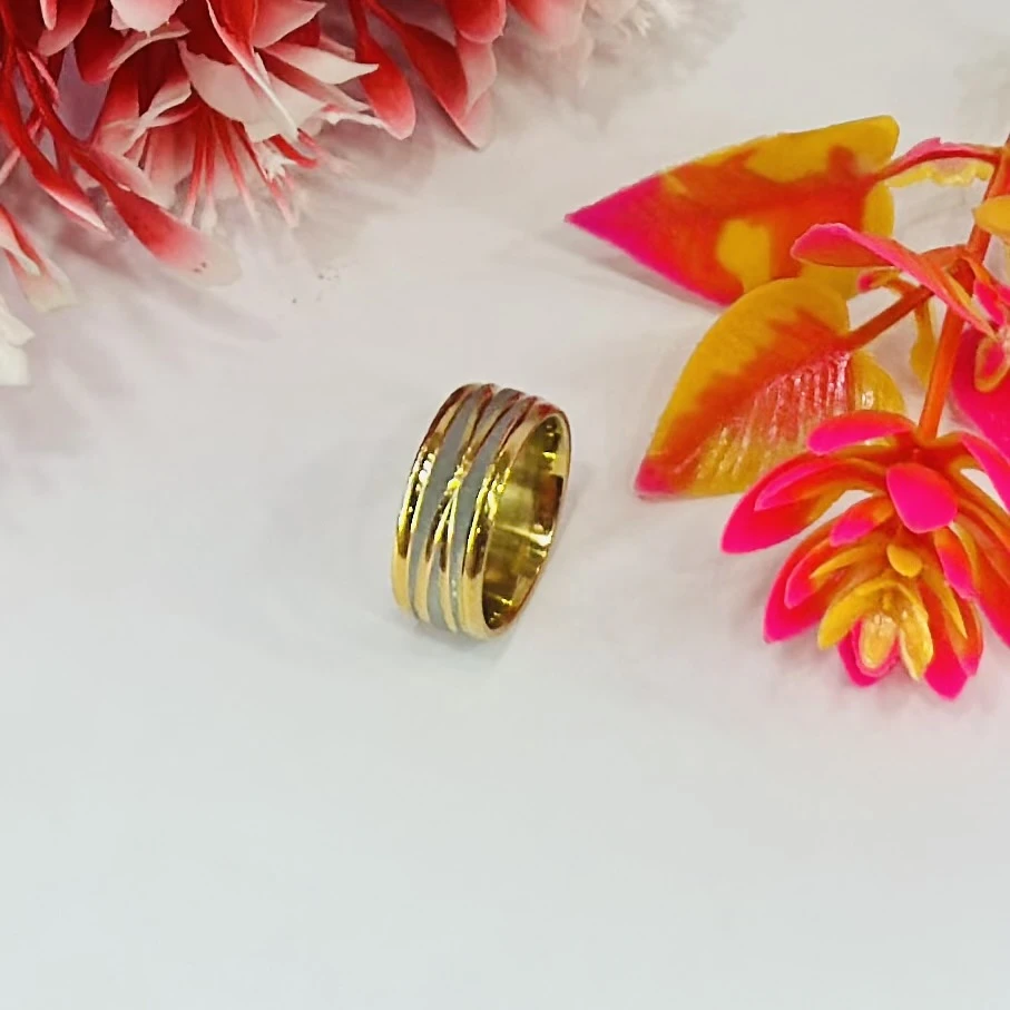 Gold and silver-toned stainless steel dual-edge wedding band with a brushed finish