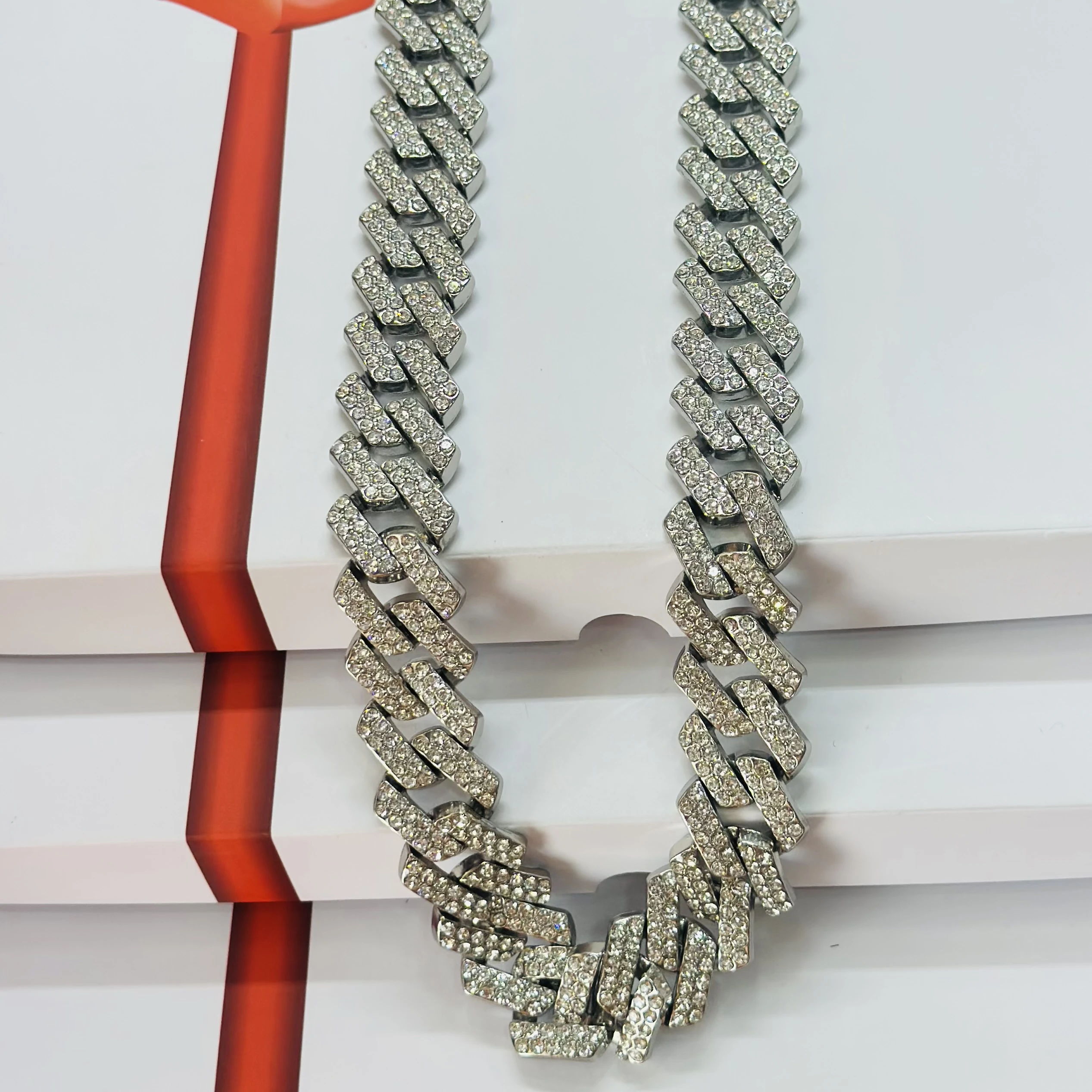 silver-plated stainless steel Cuban link chain with rhinestones.