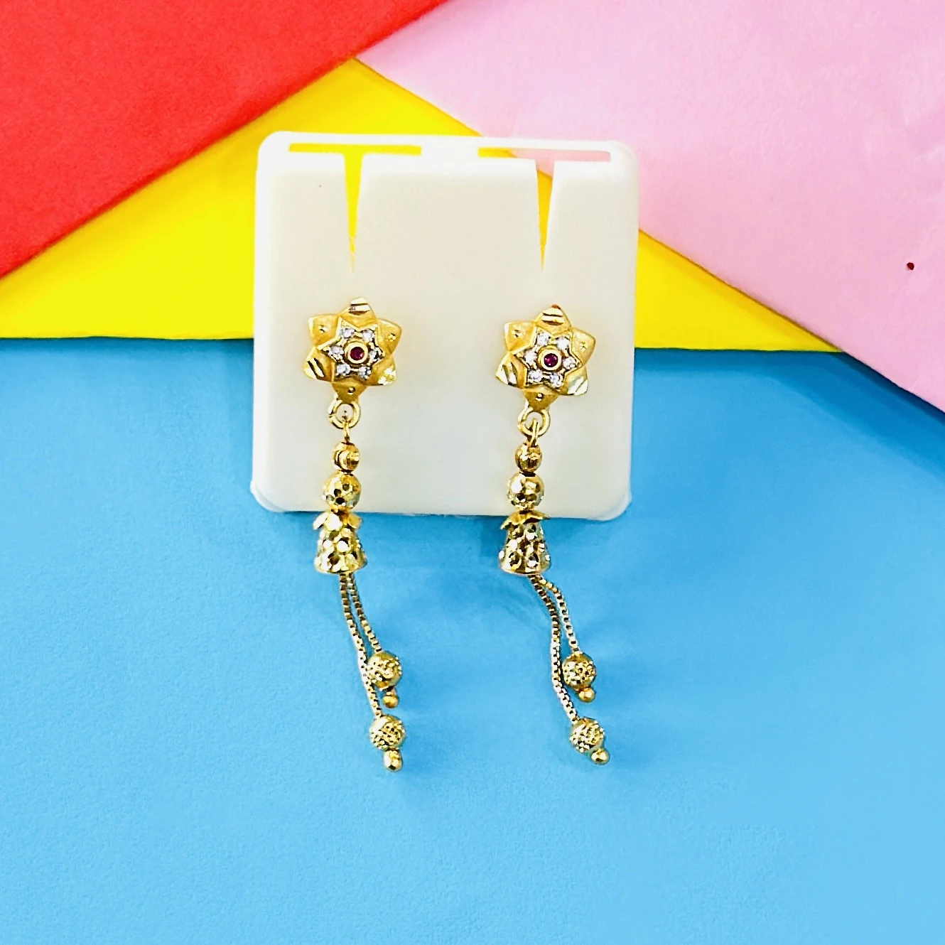 pair of intricate gold drop earrings