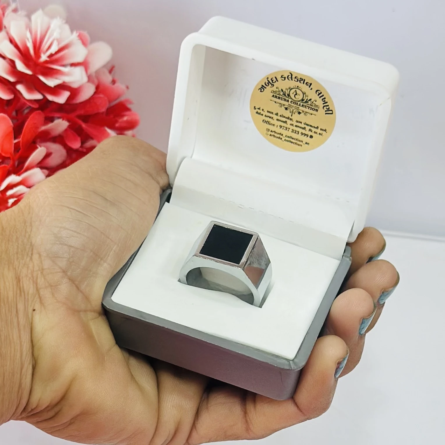 Men’s silver-toned signet ring with a black onyx stone,