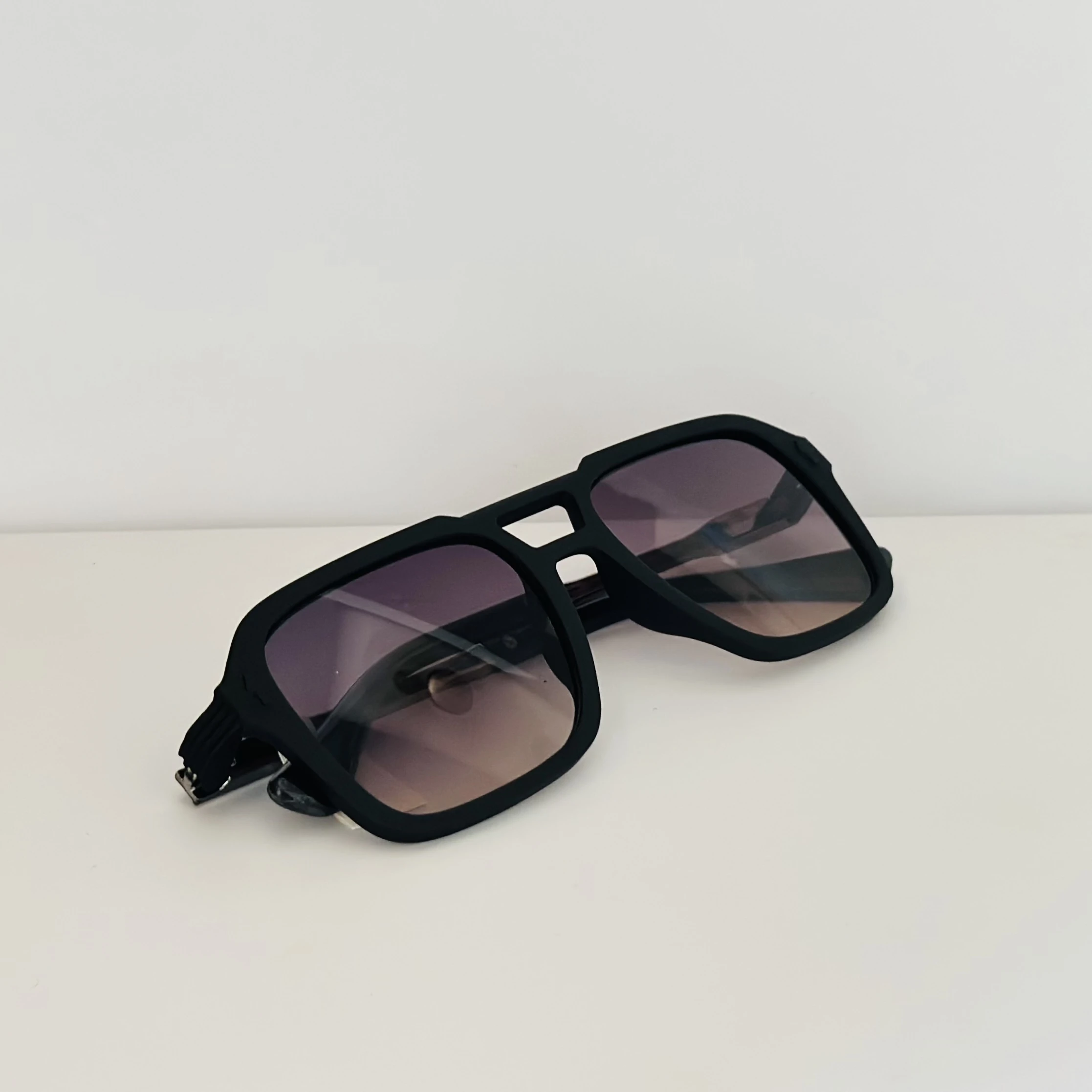 black Carrera 317/S navigator sunglasses with grey gradient lenses.