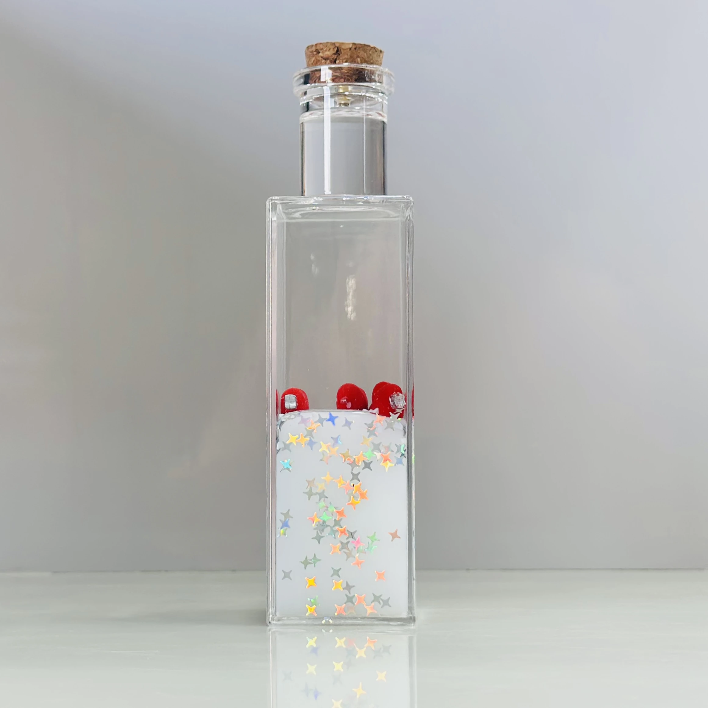 decorative fluid bottle with hearts and stars. (SKU-ATDL7R)