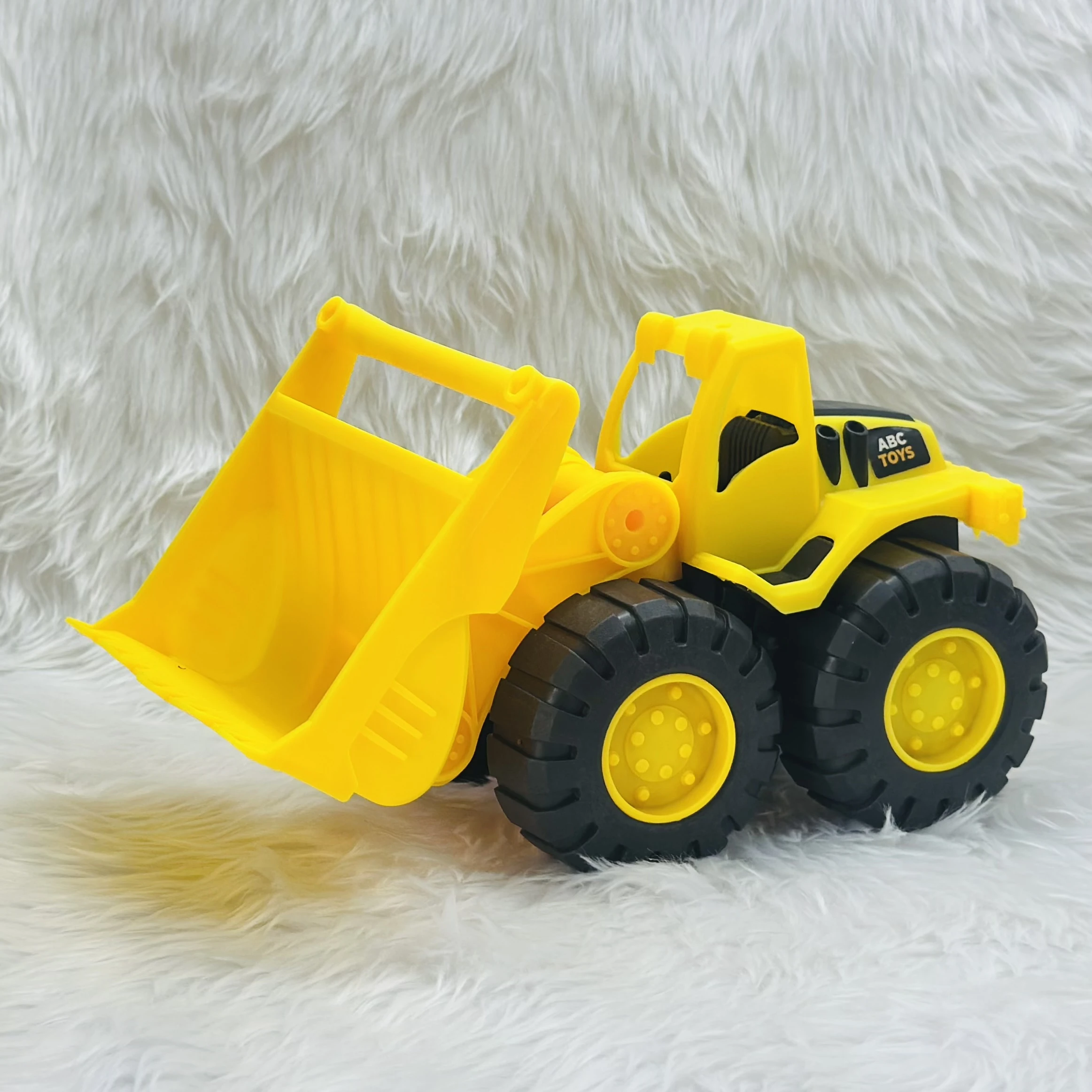 Yellow toy wheel loader,